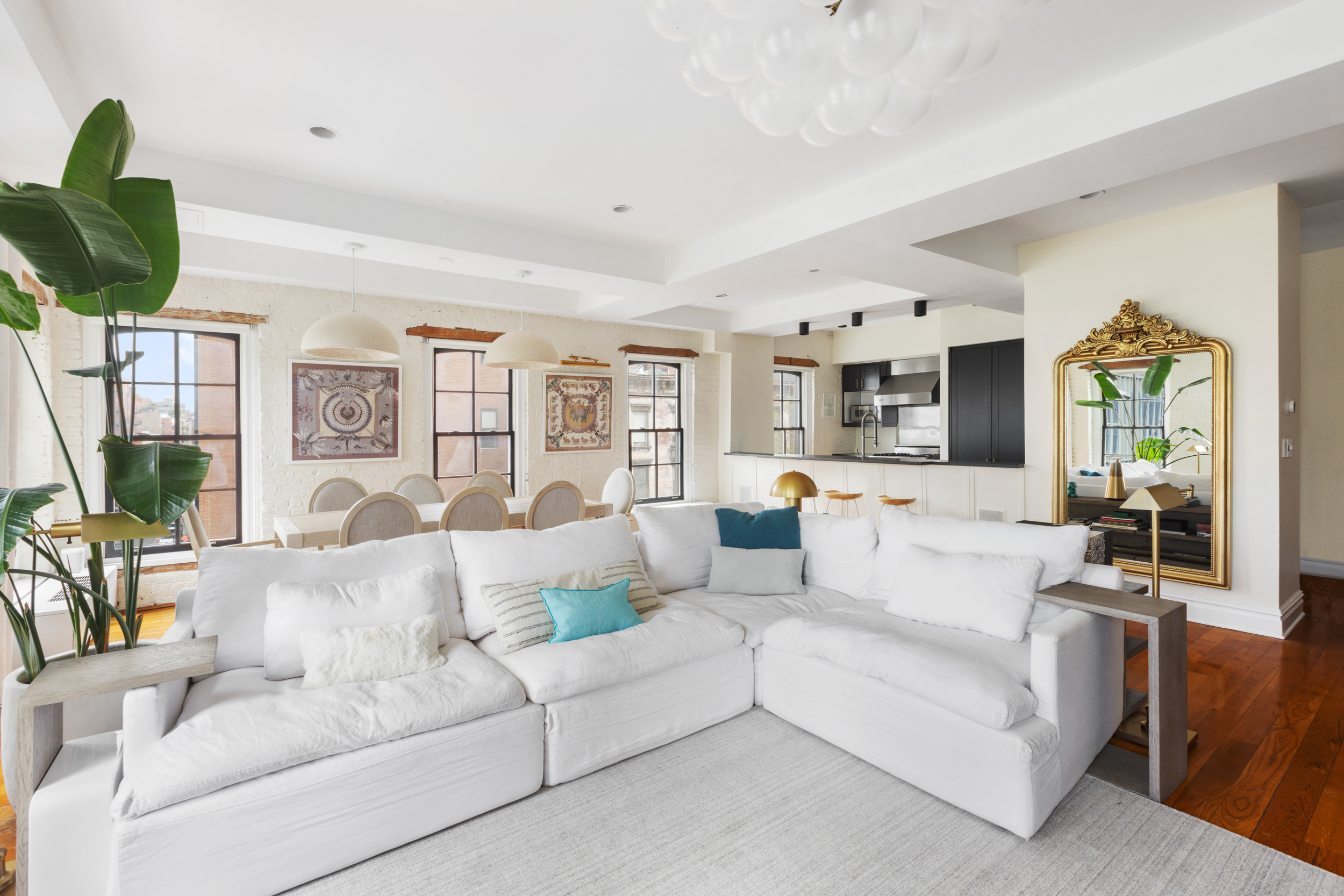 62 Beach Street, Unit 5E Manhattan, NY 10013 - Photo 2 of 15 a living room with furniture and a large window