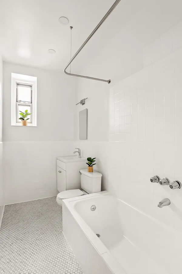 a bathroom with a bathtub and sink