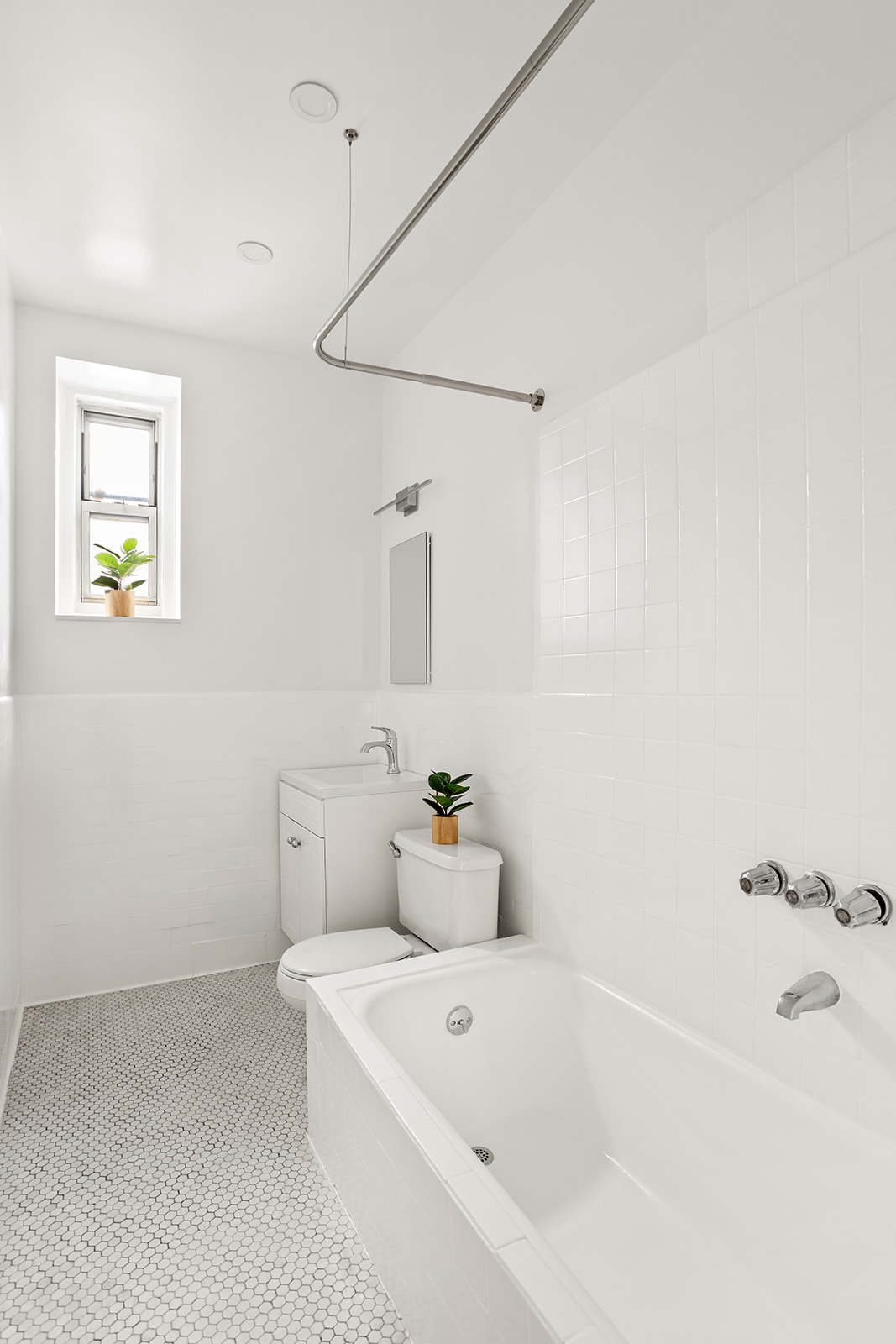 37-16 80th Street, Unit 32 Queens, NY 11372 - Photo 8 of 13 a bathroom with a bathtub and sink