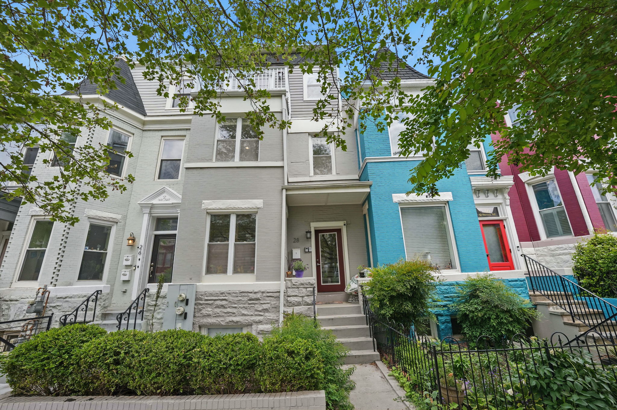 28 Q Street Northeast, Unit 2 Washington, DC 20002 - Photo 4 of 41 a front view of a house with a yard