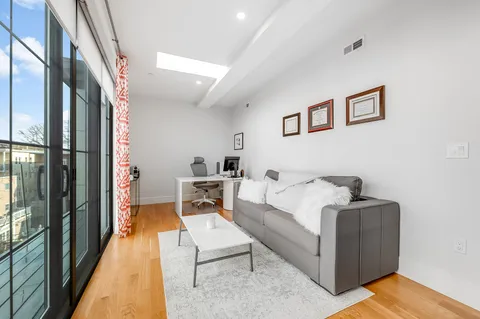 a living room with furniture and a table