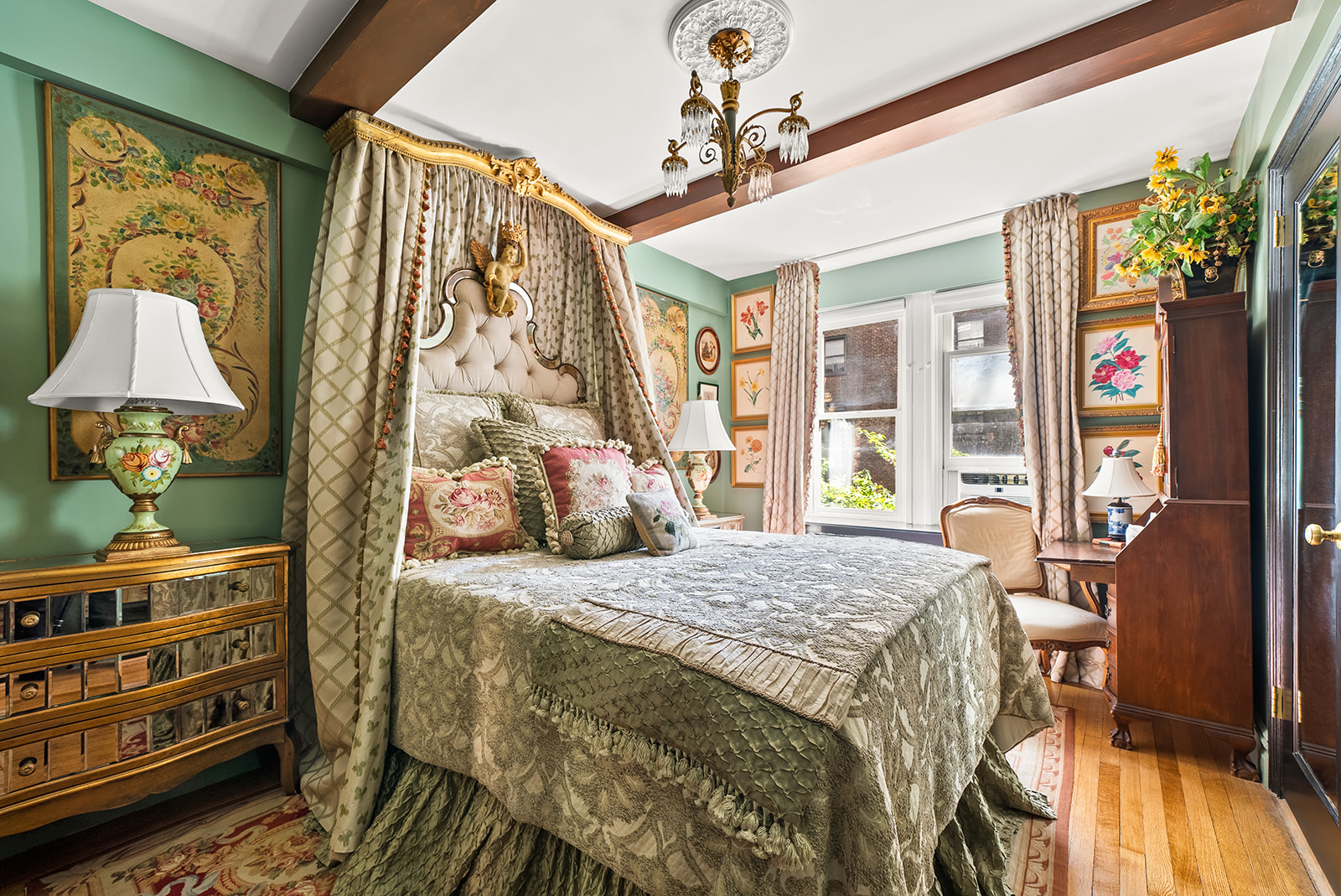 230 East 50th Street, Unit 3B Manhattan, NY 10022 - Photo 8 of 21 a bedroom with a bed and a chandelier
