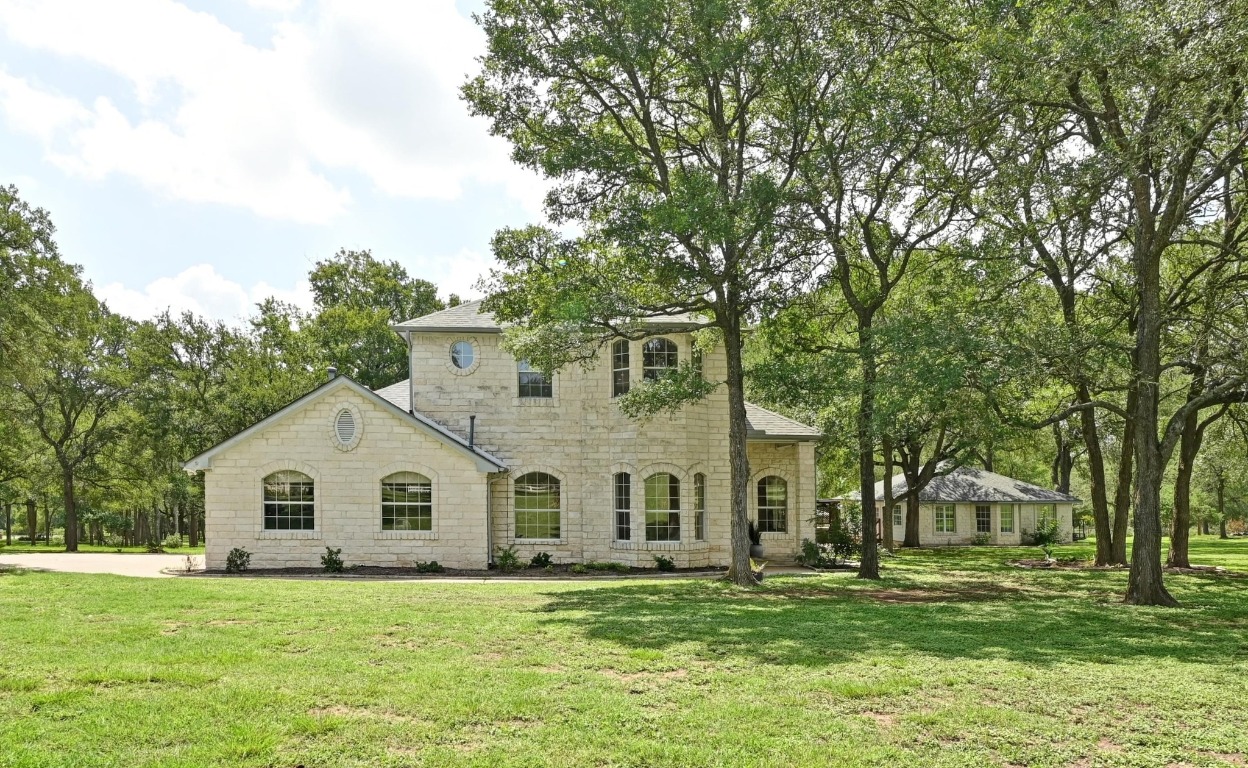 111 Trinity Street Cedar Creek, TX 78612 - Photo 1 of 38 a view of a house with a yard