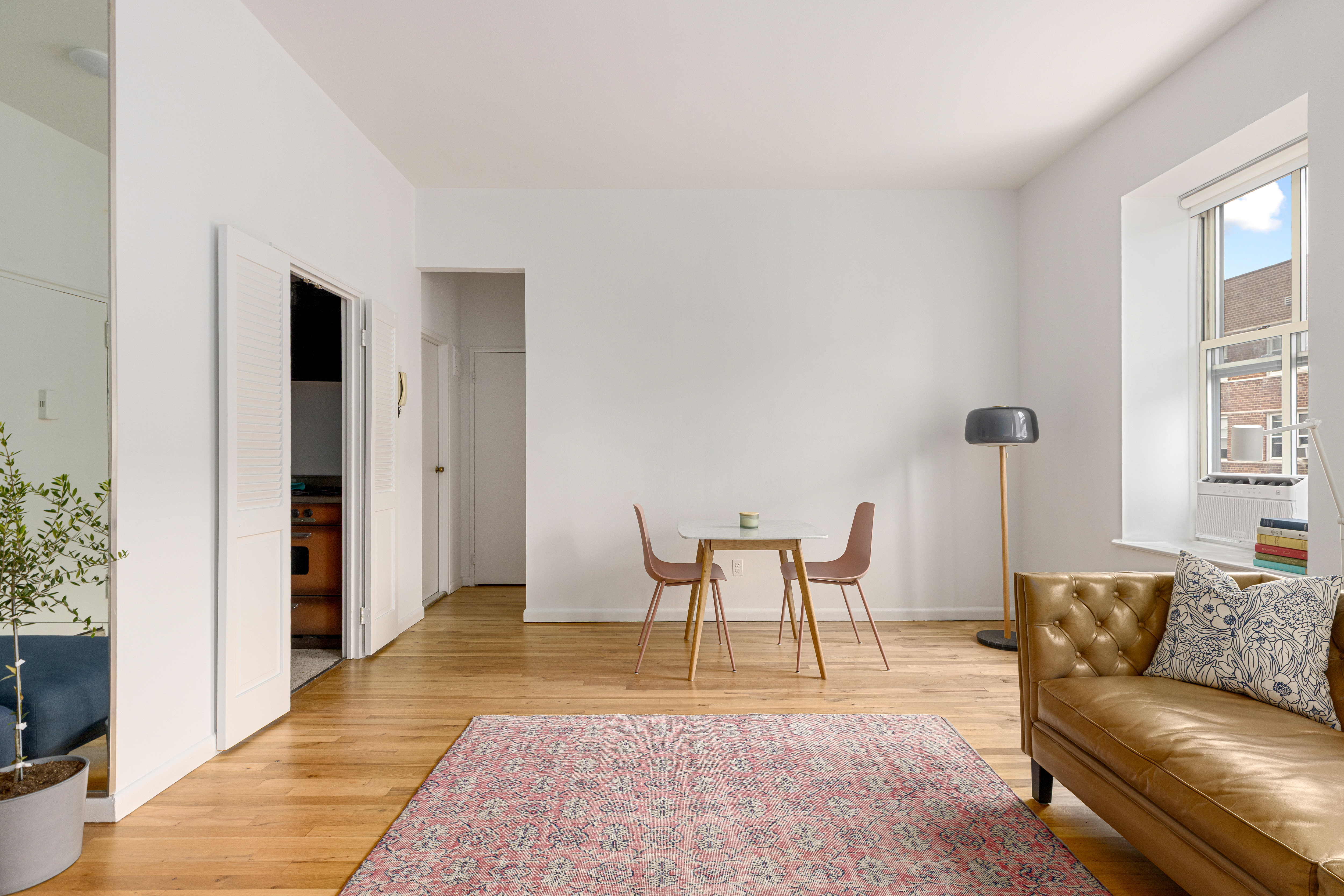 99 Bank Street, Unit 4R Manhattan, NY 10014 - Photo 3 of 15 a living room with furniture and a rug