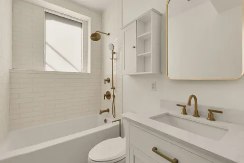 a bathroom with a sink a toilet and a bathtub