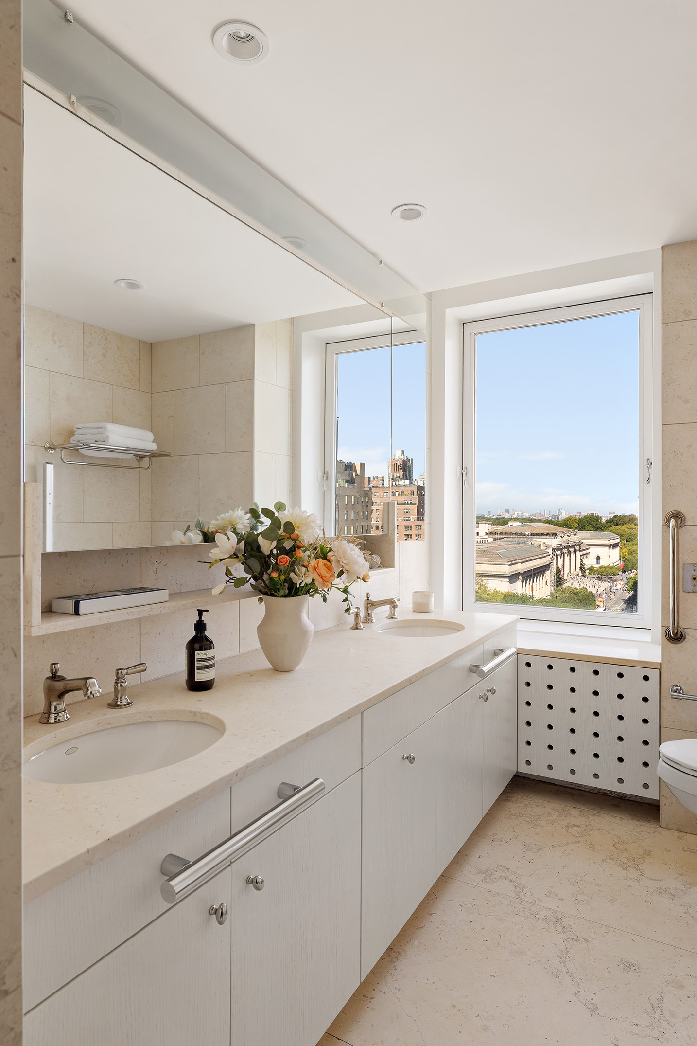 969 5th Avenue, Unit 14 Manhattan, NY 10075 - Photo 9 of 17 a bathroom with a sink double vanity and a window