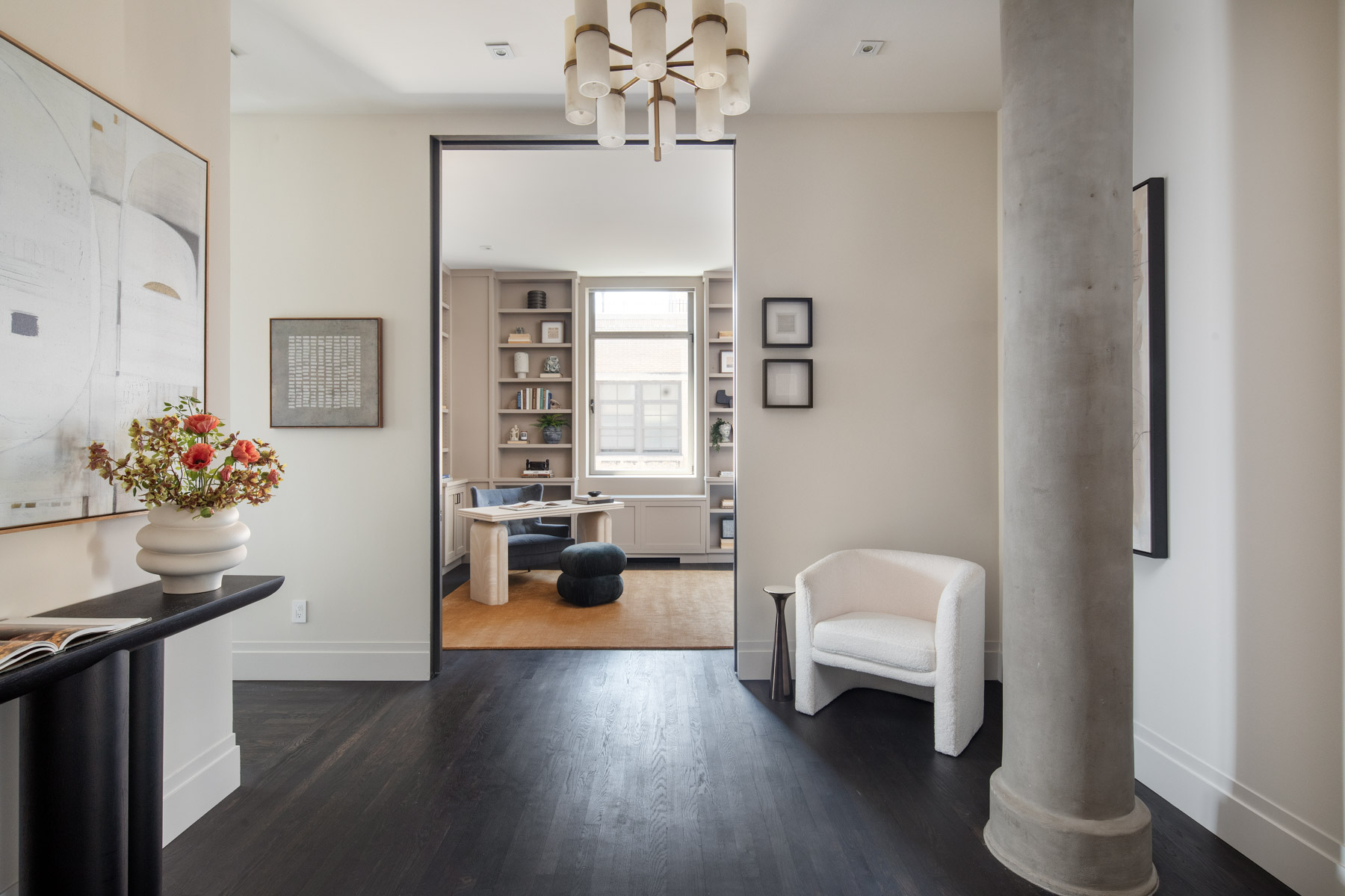252 7th Avenue, Unit 10X Manhattan, NY 10001 - Photo 5 of 20 a living room with furniture and a chandelier