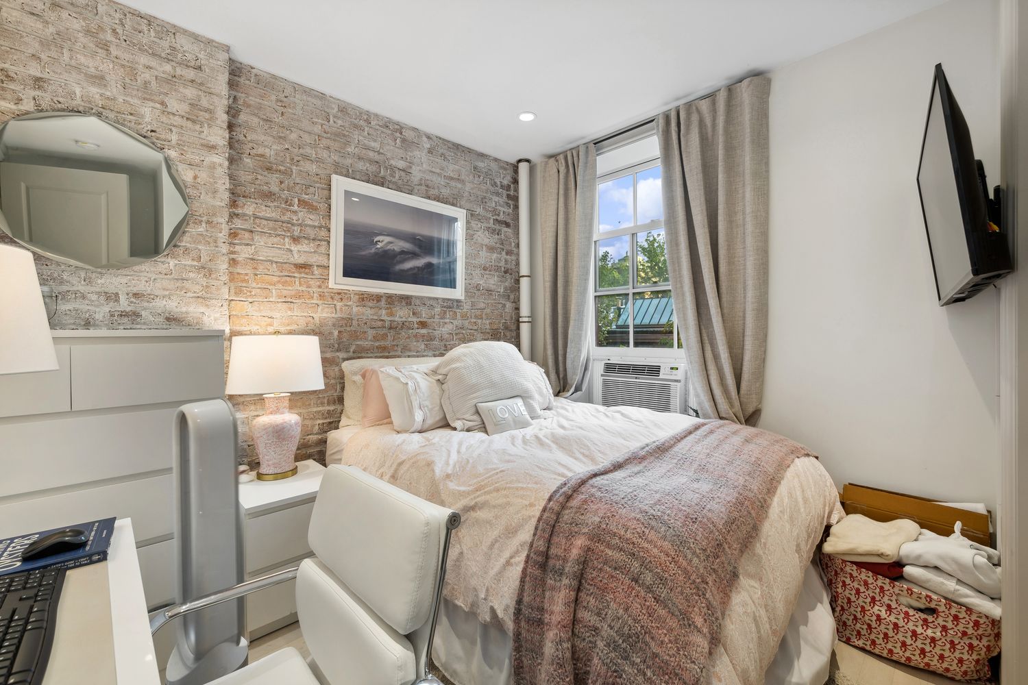 51 West 11th Street, Unit 3F Manhattan, NY 10011 - Photo 5 of 6 a bedroom with a bed a flat screen tv and balcony