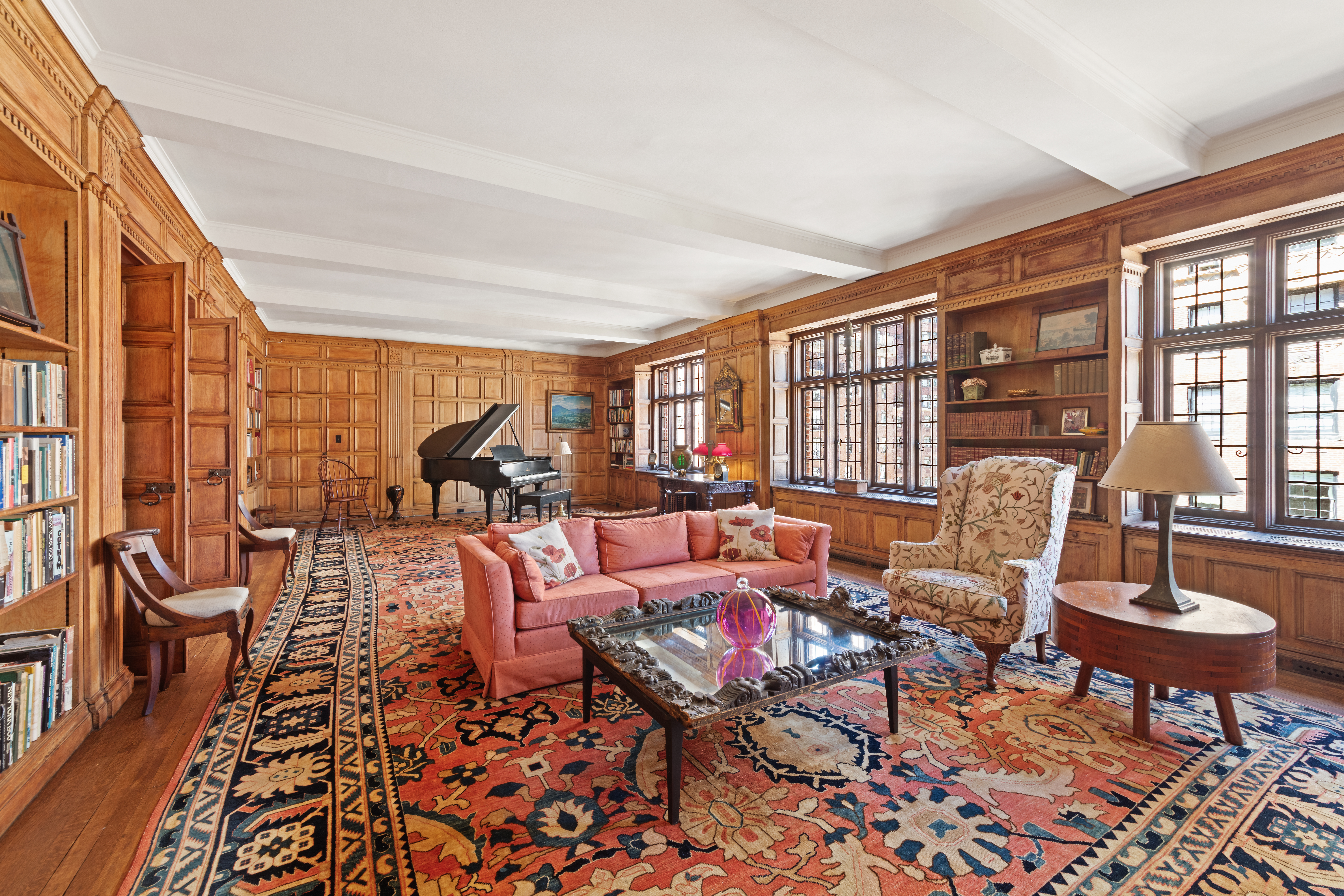 151 East 79th Street Manhattan, NY 10075 - Photo 4 of 15 a living room with furniture and a large window