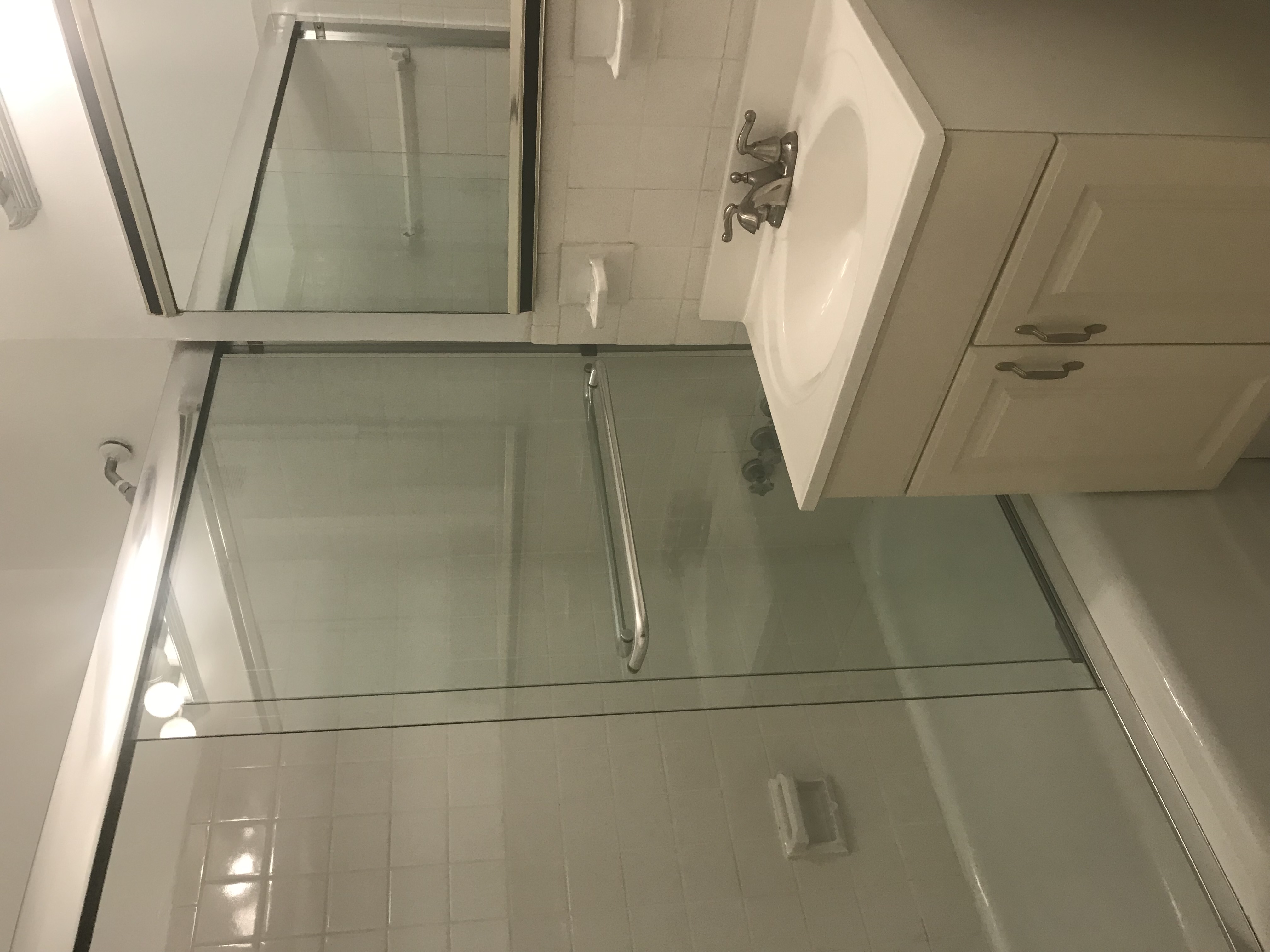 301 East 22nd Street, Unit 5G Manhattan, NY 10010 - Photo 5 of 10 a bathroom with a sink and a mirror