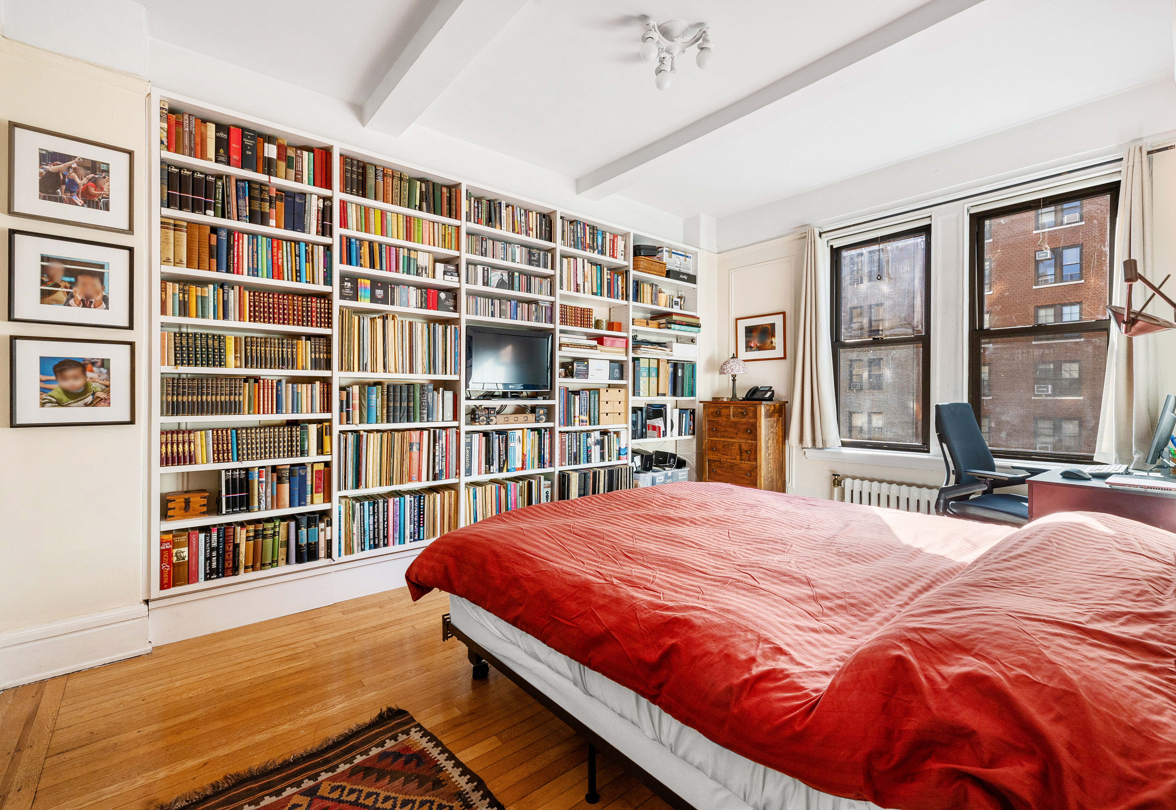 269 West 72nd Street, Unit 9B Manhattan, NY 10023 - Photo 7 of 13 a bedroom with a bed and wooden floor