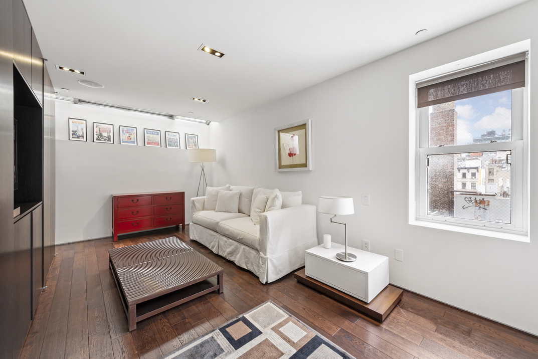 405 Broadway, Unit PH Manhattan, NY 10013 - Photo 13 of 17 a living room with furniture and a window