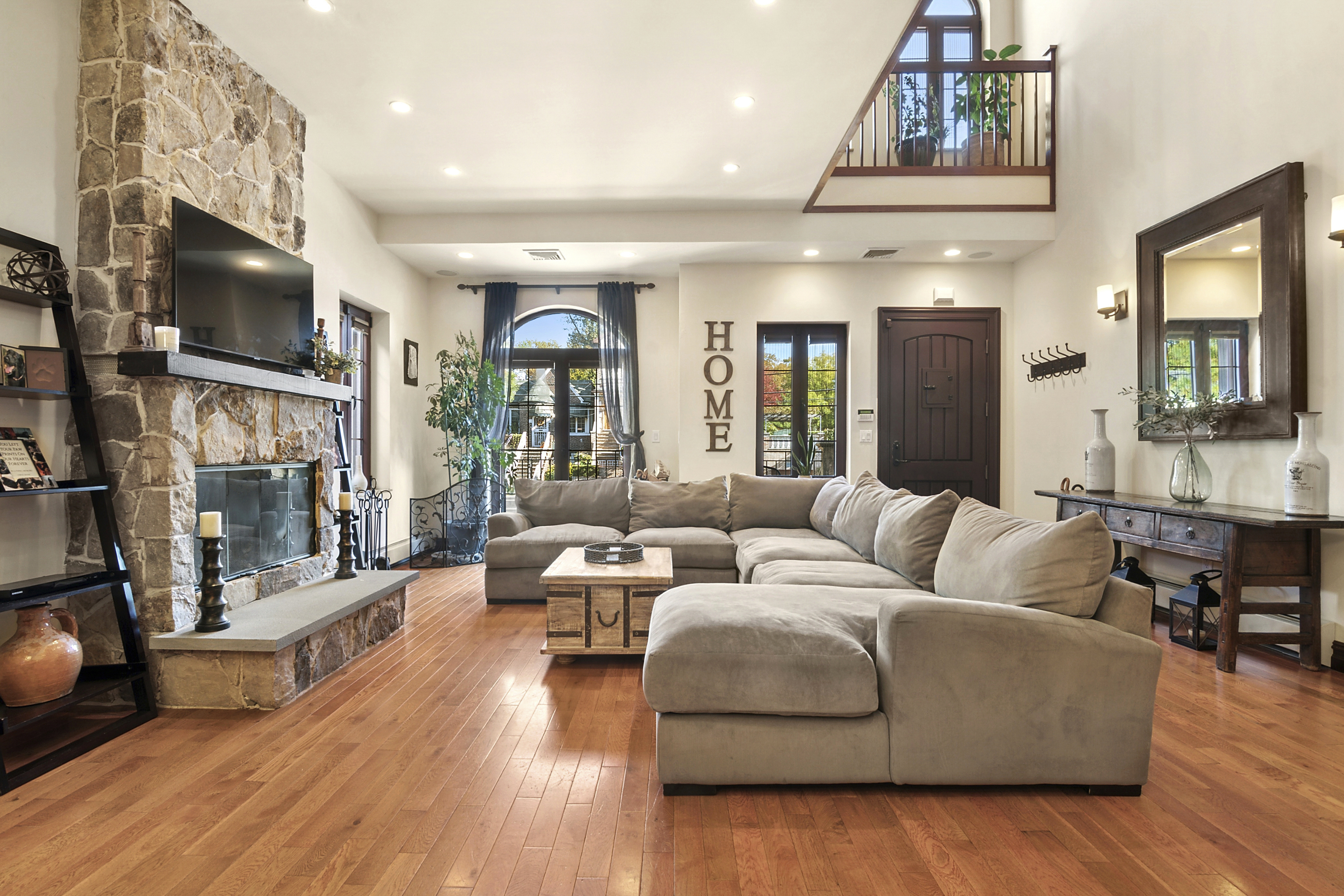 a living room with fireplace furniture and a flat screen tv