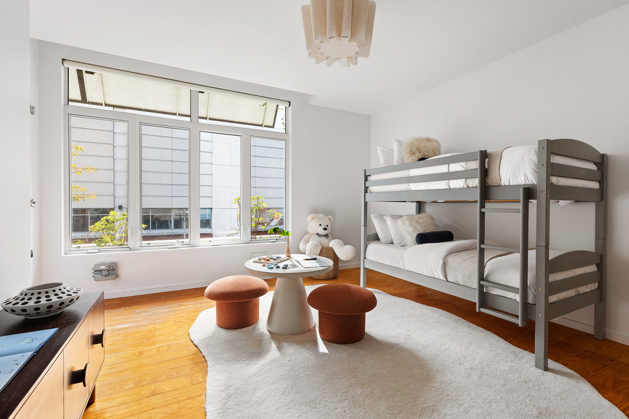 345 West 54th Street Manhattan, NY 10019 - Photo 9 of 22 a dining room with furniture and a window