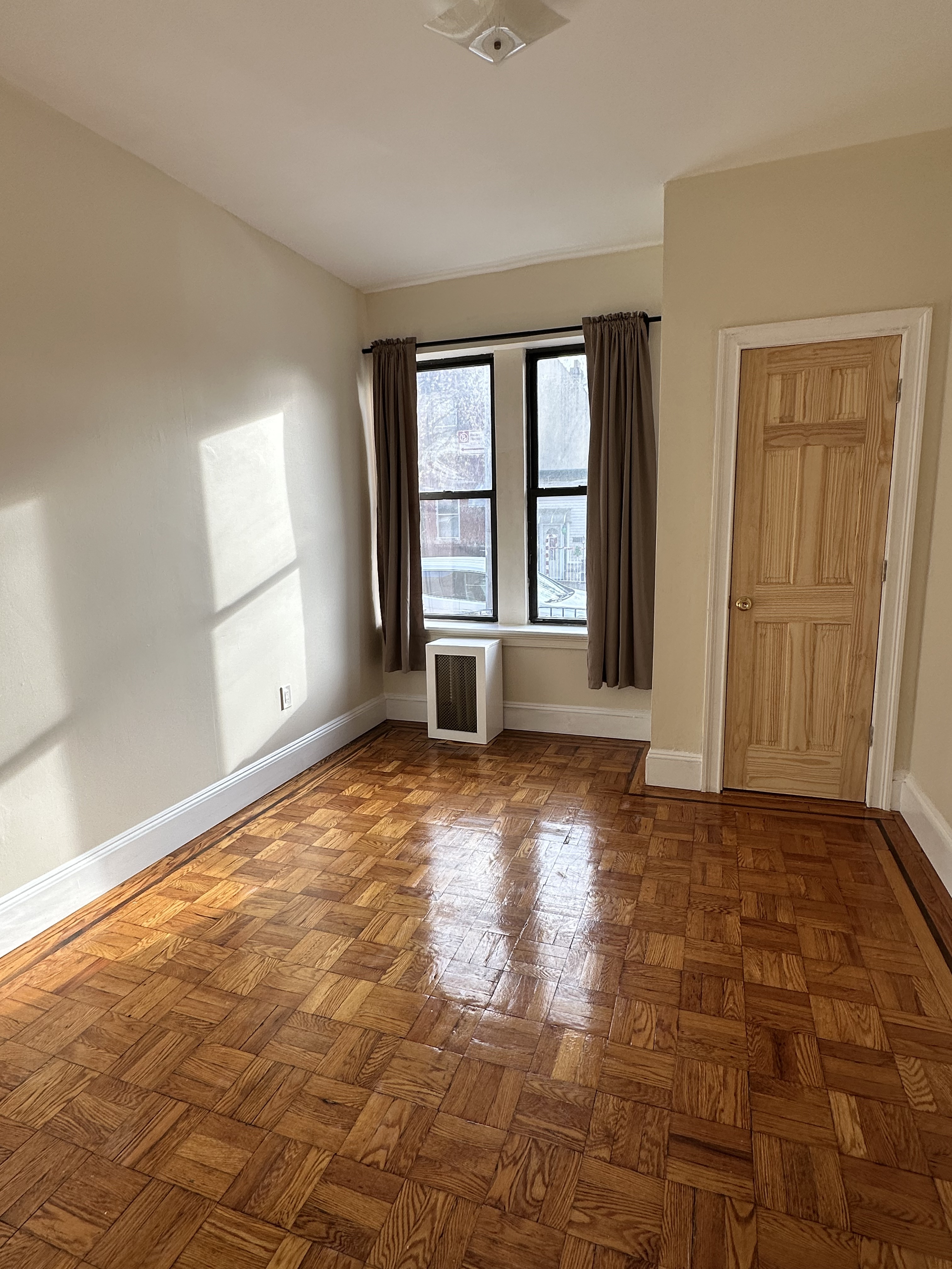 31-40 42nd Street, Unit 1F Queens, NY 11103 - Photo 7 of 9 a view of an empty room with a window