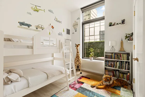 a bedroom with a bed furniture and a window