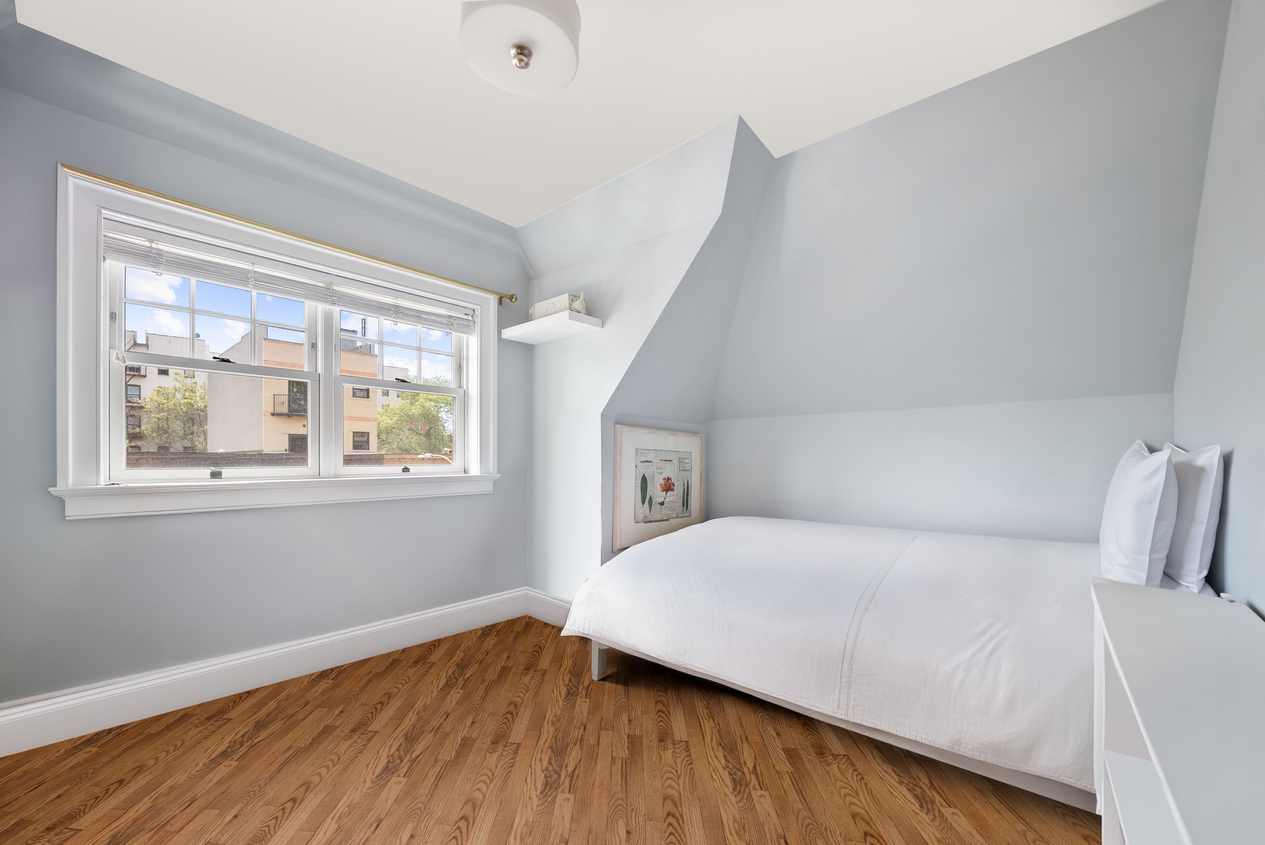 139 Winthrop Street, Unit 2 Brooklyn, NY 11225 - Photo 7 of 8 a bedroom with a bed and a window