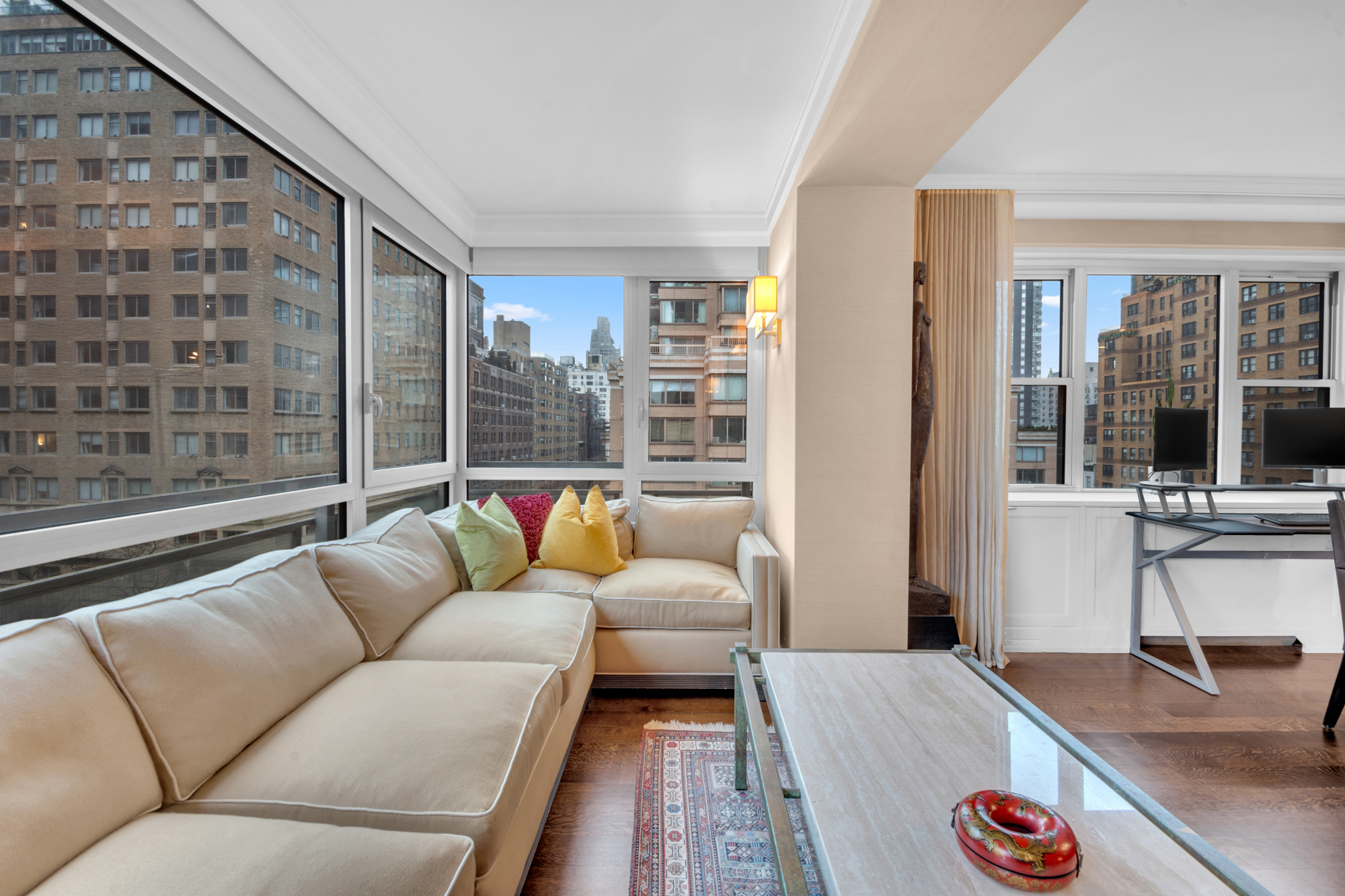 150 East 69th Street, Unit 6Q Manhattan, NY 10021 - Photo 11 of 15 a living room with furniture and a large window