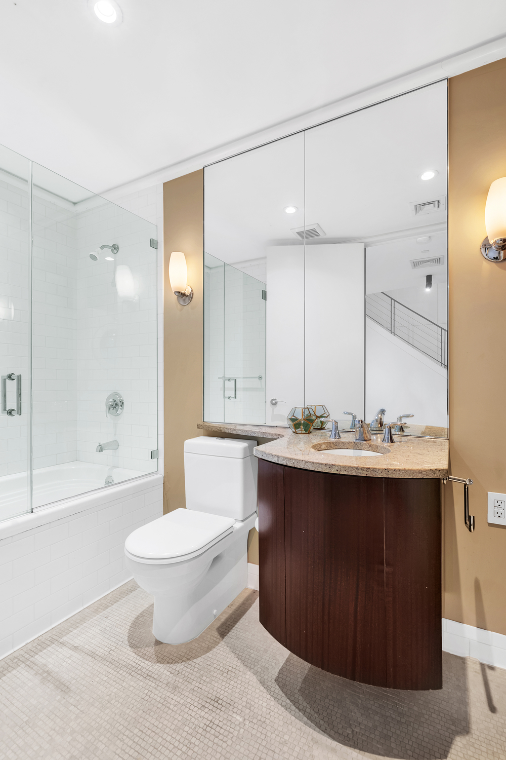 200 Mercer Street, Unit MAIS-G Manhattan, NY 10012 - Photo 12 of 17 a bathroom with a sink and mirror