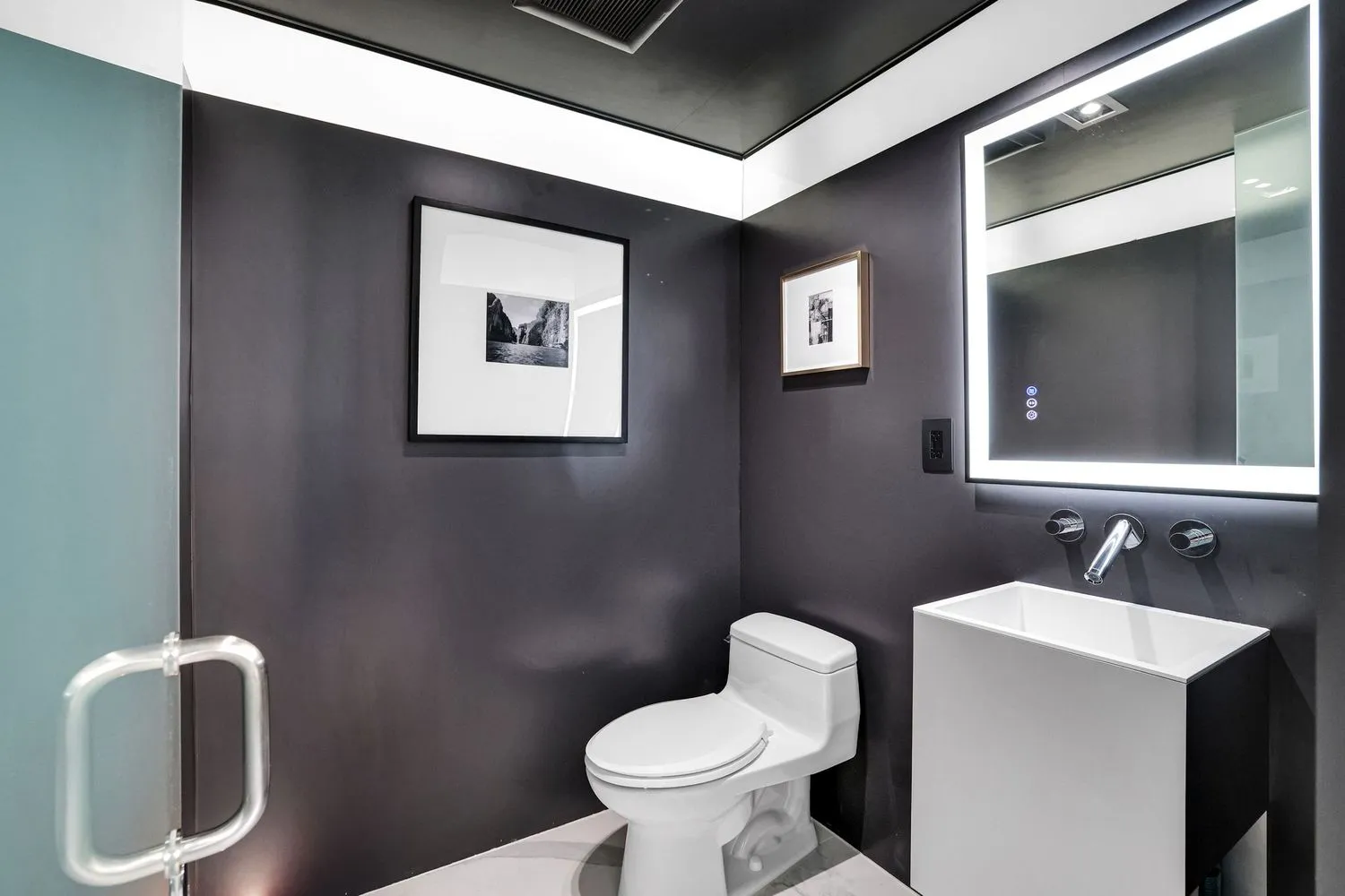 a living room with couches and a flat screen tv