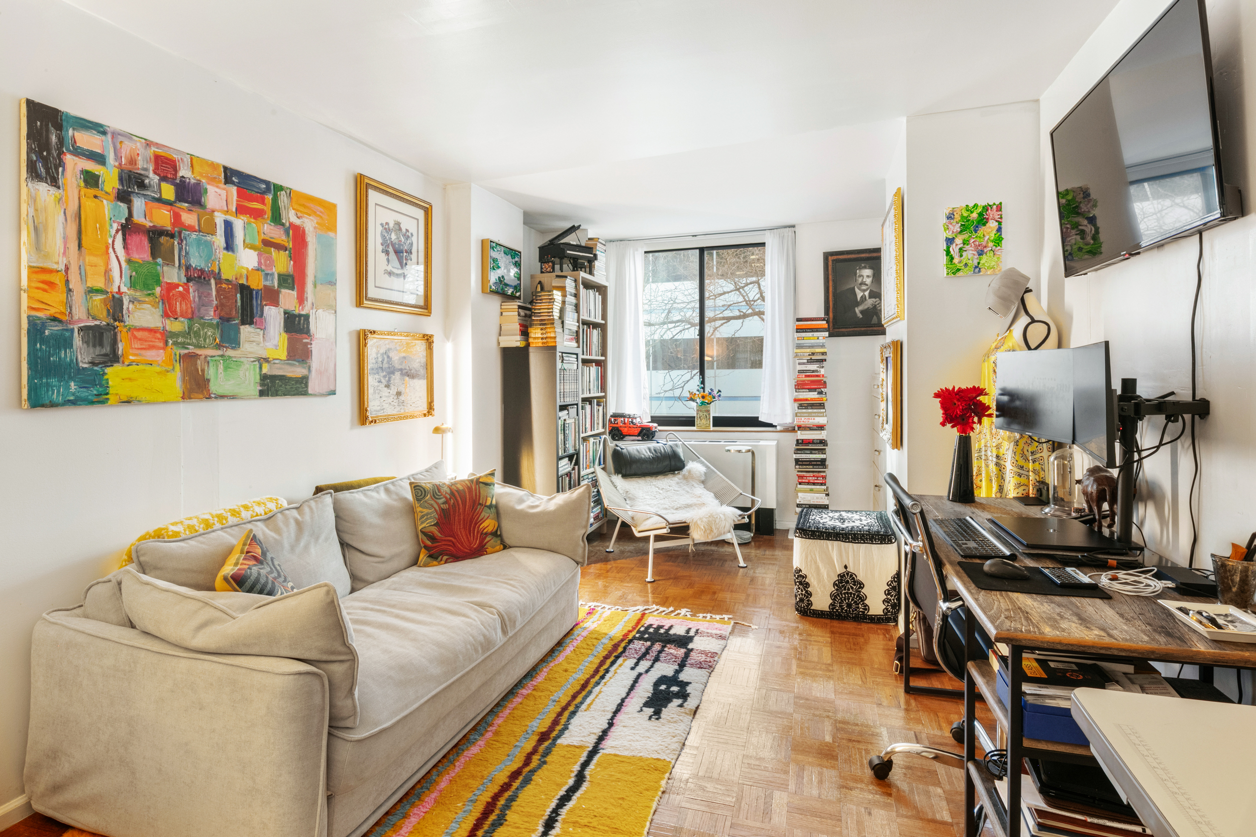 a living room with furniture and a flat screen tv