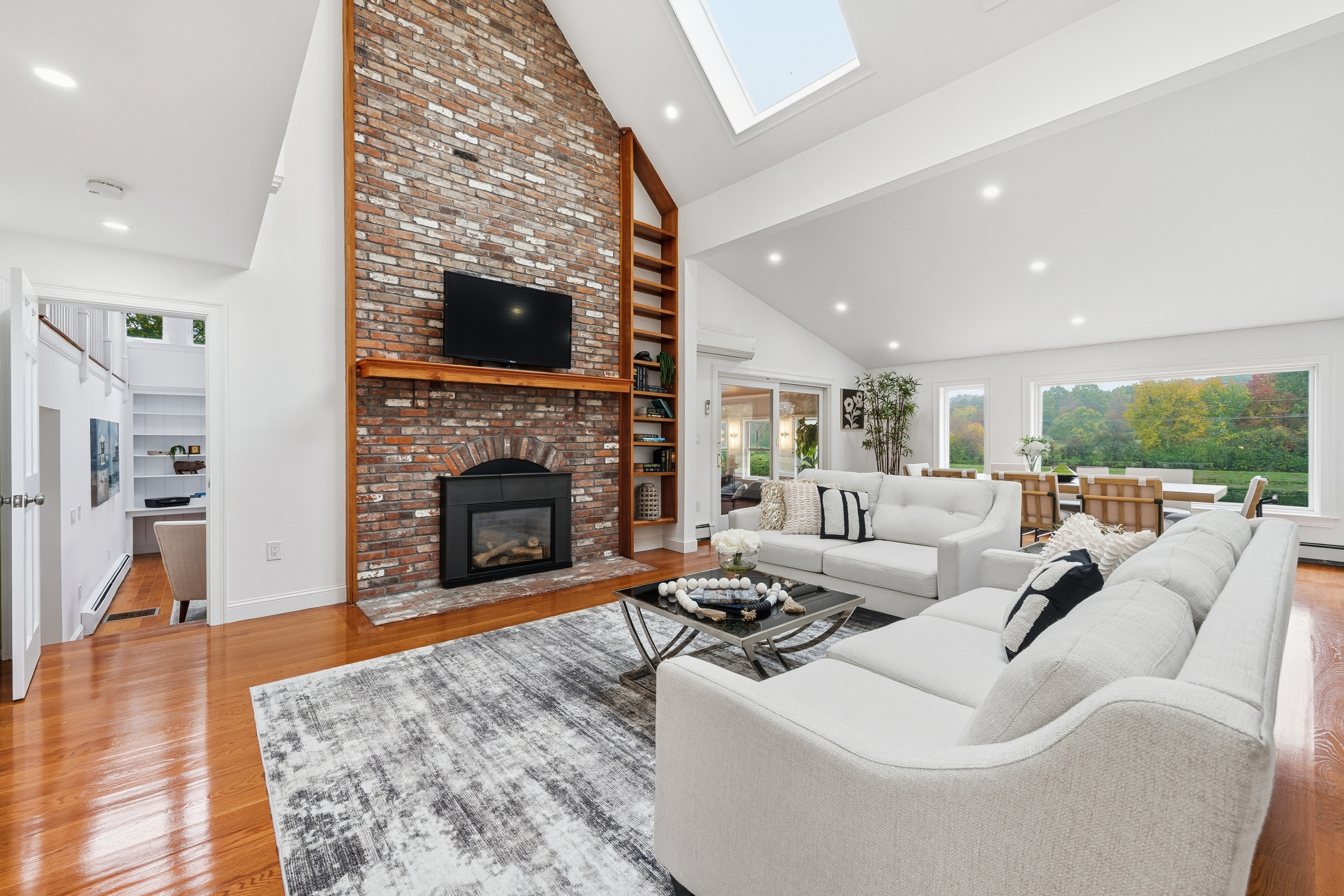 6 Lynbrook Road Southborough, MA 01772 - Photo 13 of 84 a living room with furniture a fireplace and a flat screen tv