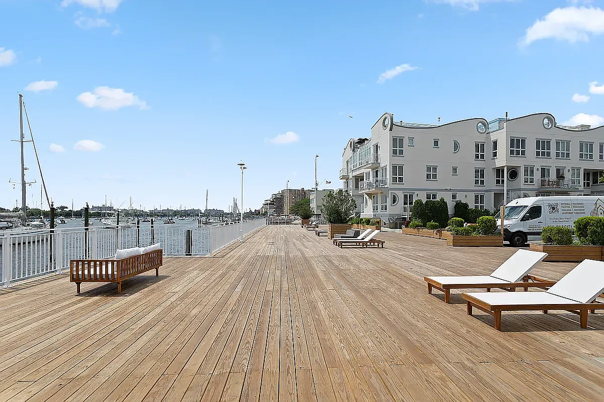 3112 Emmons Avenue, Unit 3132-2 Brooklyn, NY 11235 - Photo 10 of 11 a swimming pool with outdoor seating and yard