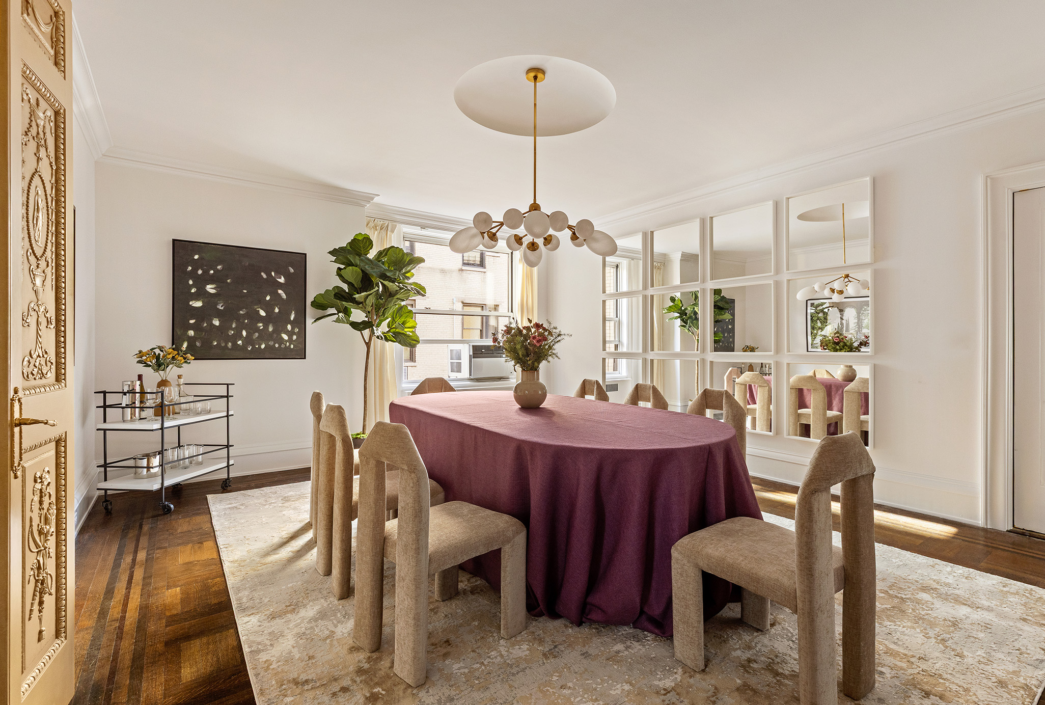 875 Park Avenue, Unit 11C Manhattan, NY 10075 - Photo 9 of 25 a view of a dining room with furniture and wooden floor