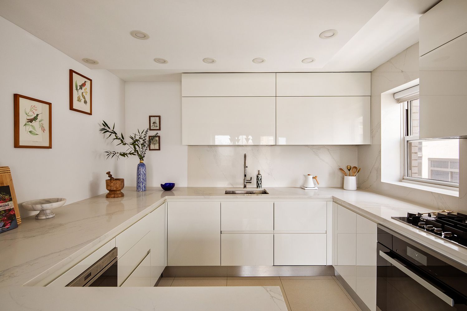 a kitchen with a sink stove and cabinets