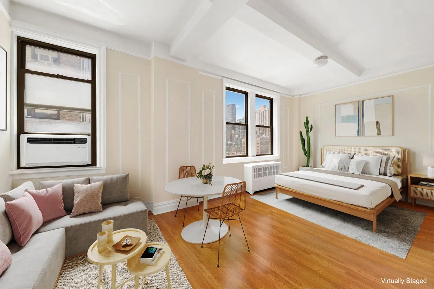 a spacious bedroom with a bed a couch and a window