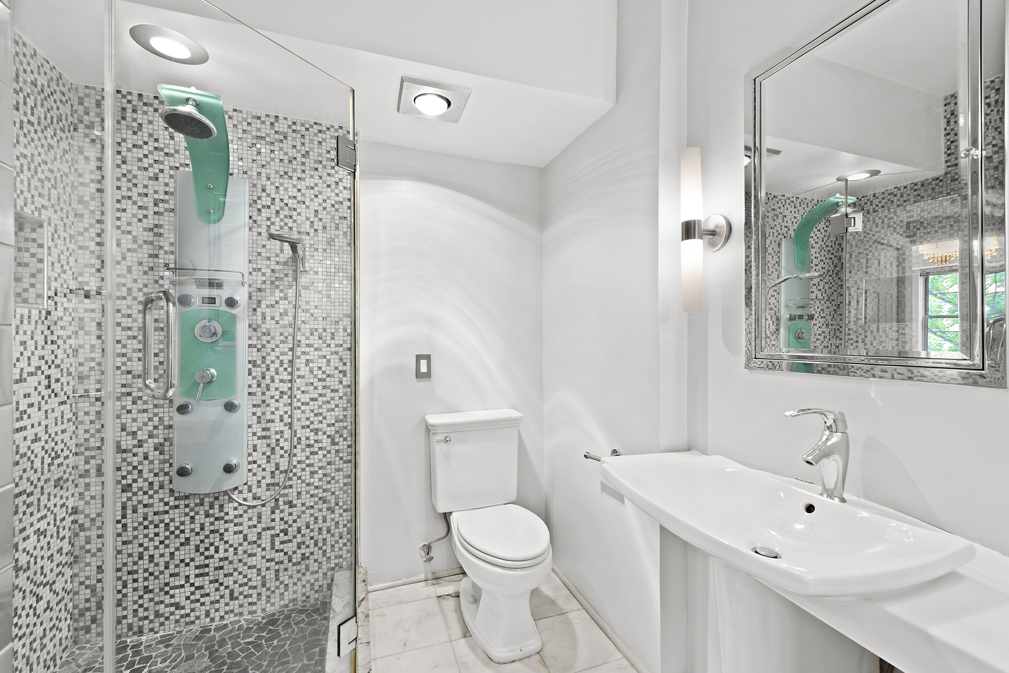 163 St Nicholas Avenue, Unit 2J Manhattan, NY 10026 - Photo 6 of 13 a bathroom with a toilet sink and shower
