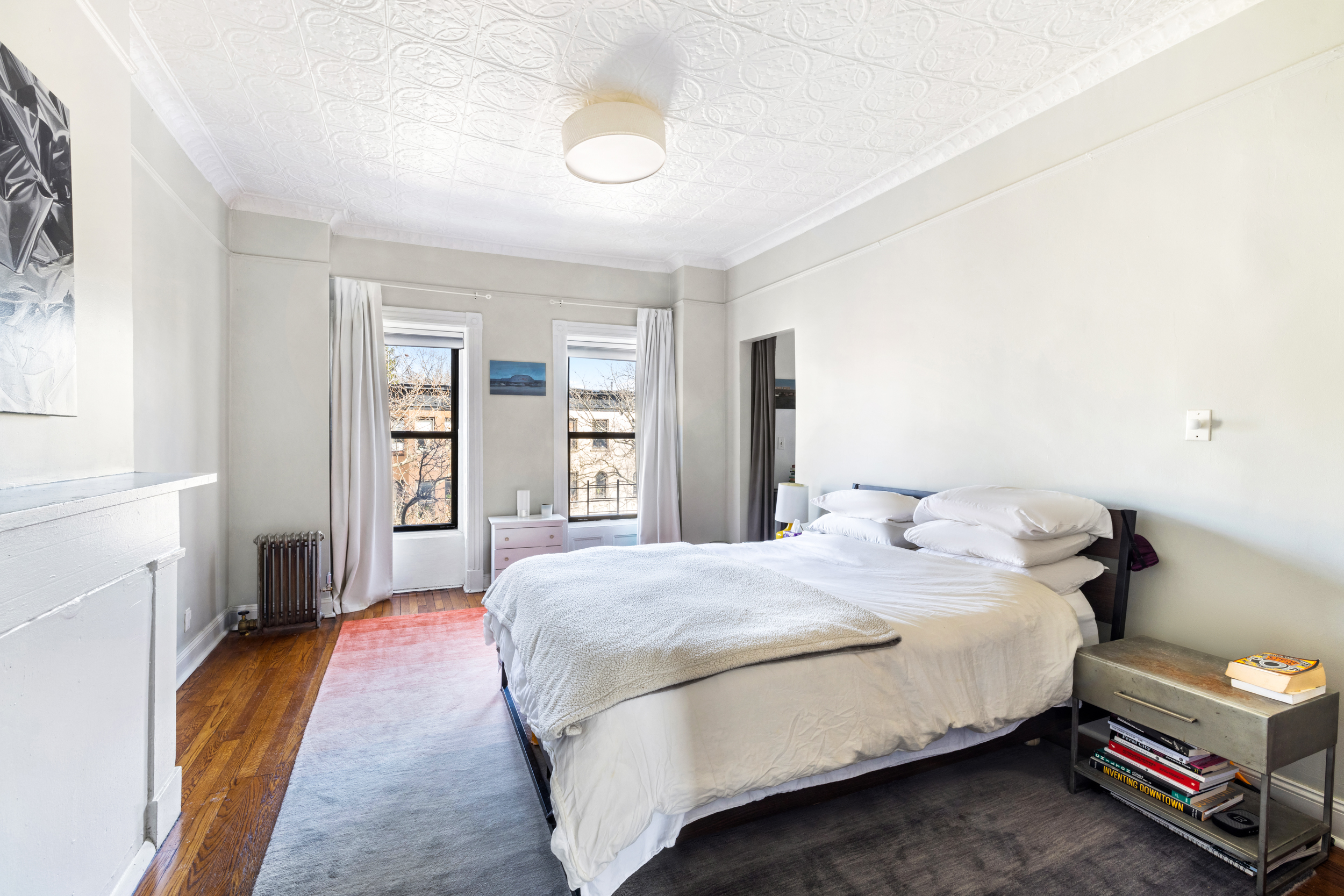 252 Stuyvesant Avenue Brooklyn, NY 11221 - Photo 23 of 26 a bedroom with a bed and a window