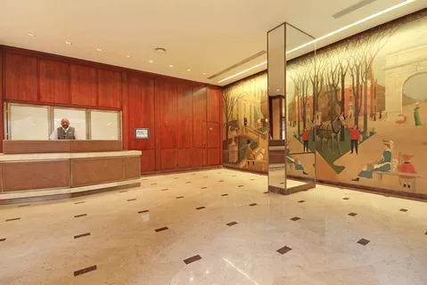 a living room with dining room and wooden floor