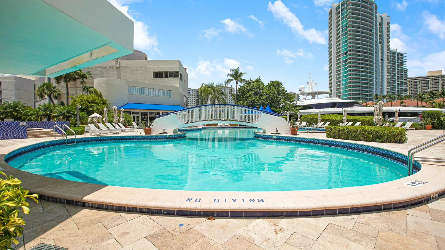 a view of a swimming pool with a patio