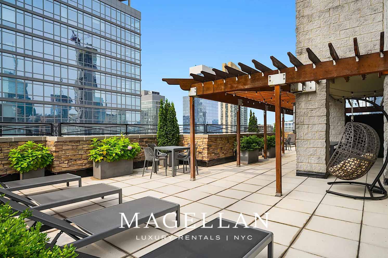 a view of a patio with table and chairs and potted plants