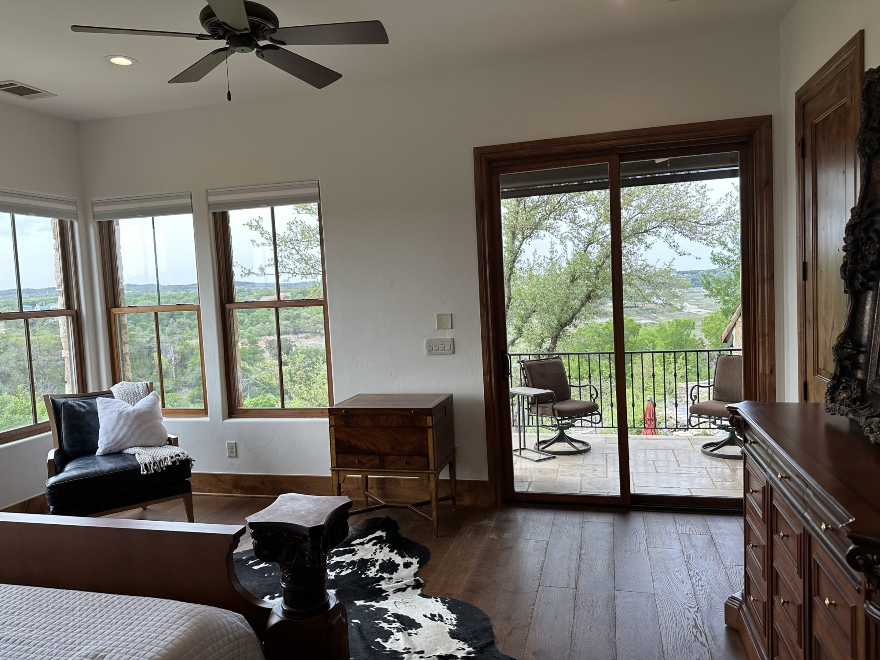 808 Rivercliff Drive Spicewood, TX 78669 - Photo 37 of 71 a living room with furniture floor to ceiling window and a flat screen tv