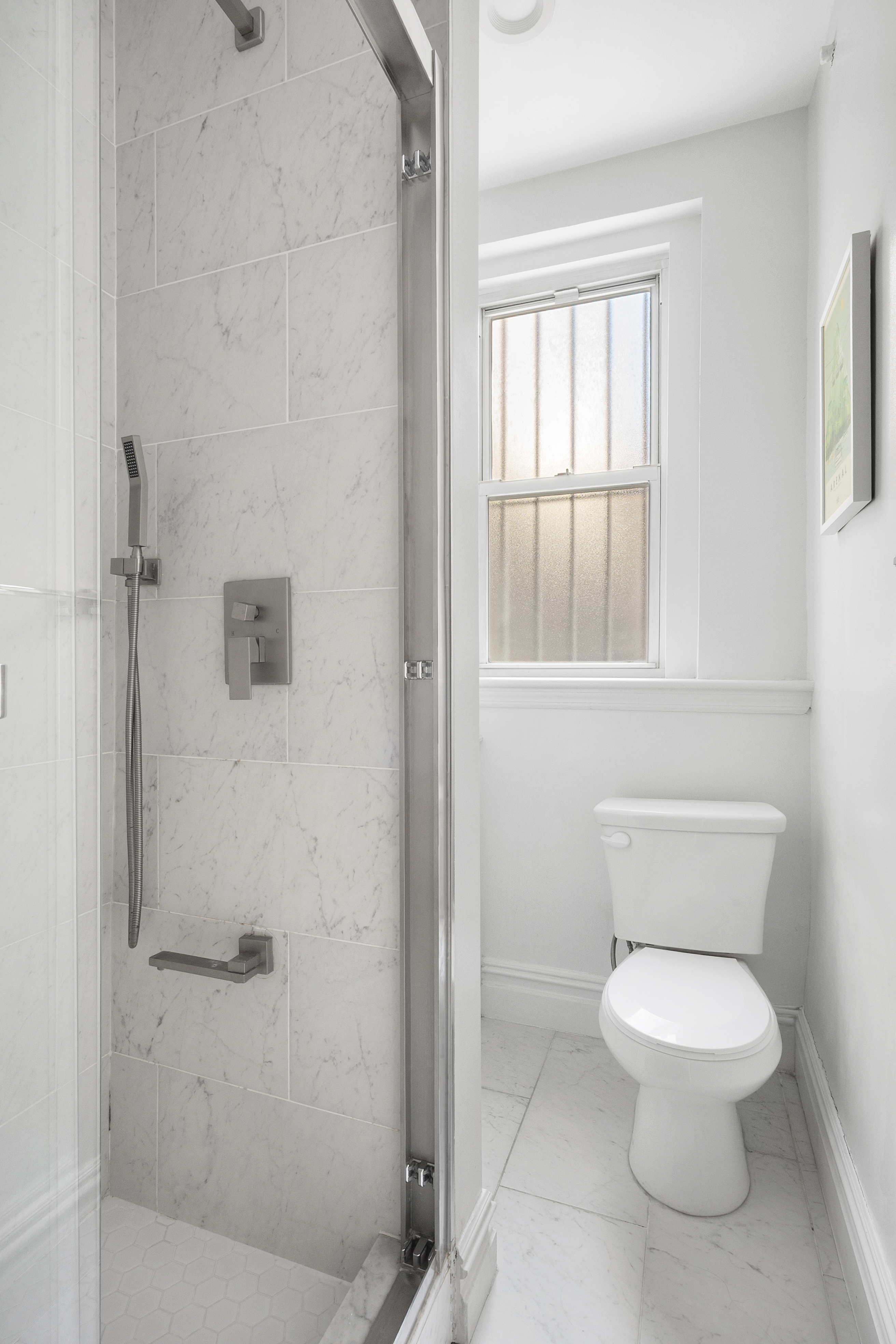 345 West 70th Street, Unit 5E Manhattan, NY 10023 - Photo 7 of 10 a white toilet sitting next to a bathroom sink