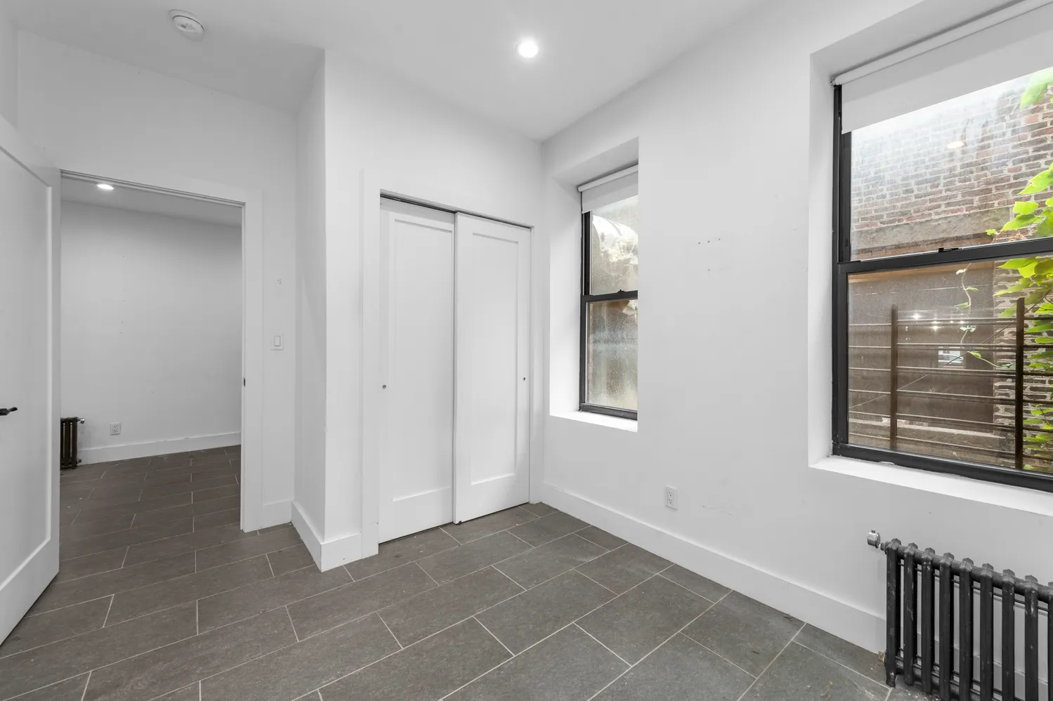 a view of an empty room with a window