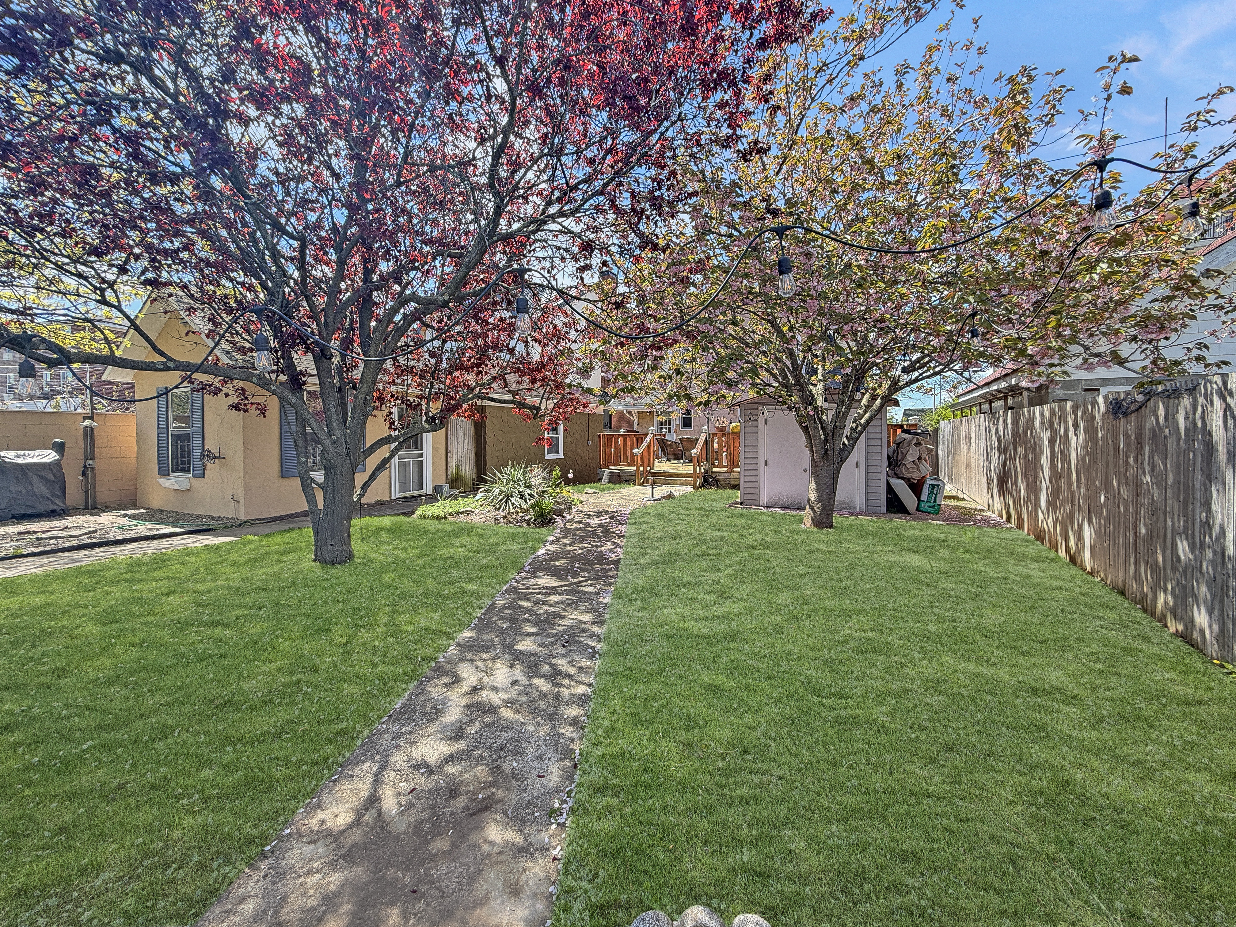 5007 Surf Avenue Brooklyn, NY 11224 - Photo 21 of 37 a front view of a house with a yard and tree