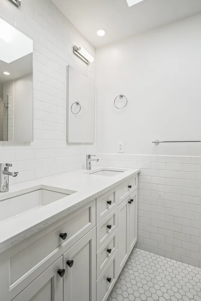 a bathroom with a glass shower door