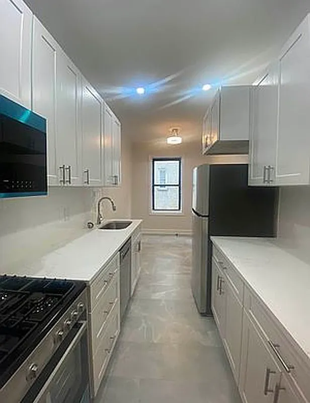 625 Caton Avenue, Unit 4E Brooklyn, NY 11218 - Photo 1 of 12 a kitchen with a sink stove top oven and cabinets