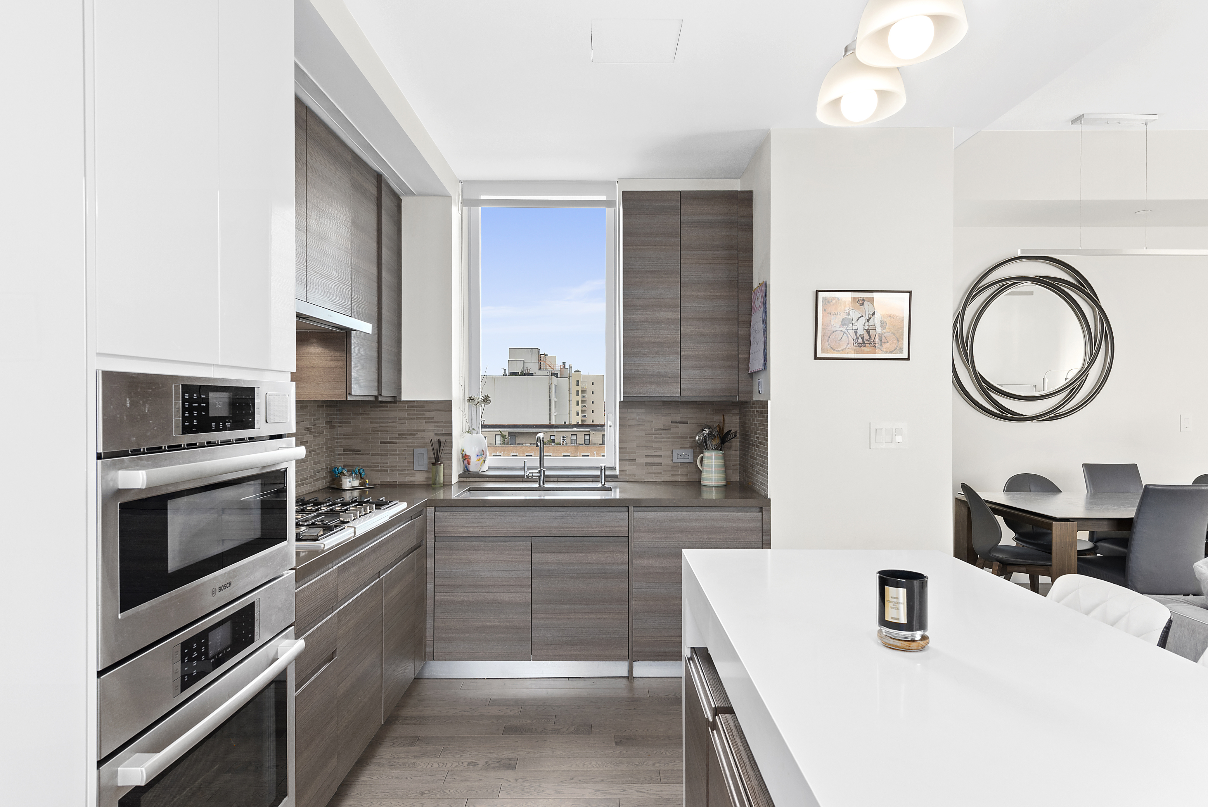 285 West 110th Street, Unit 9B Manhattan, NY 10026 - Photo 3 of 20 a kitchen with a sink and a stove top oven