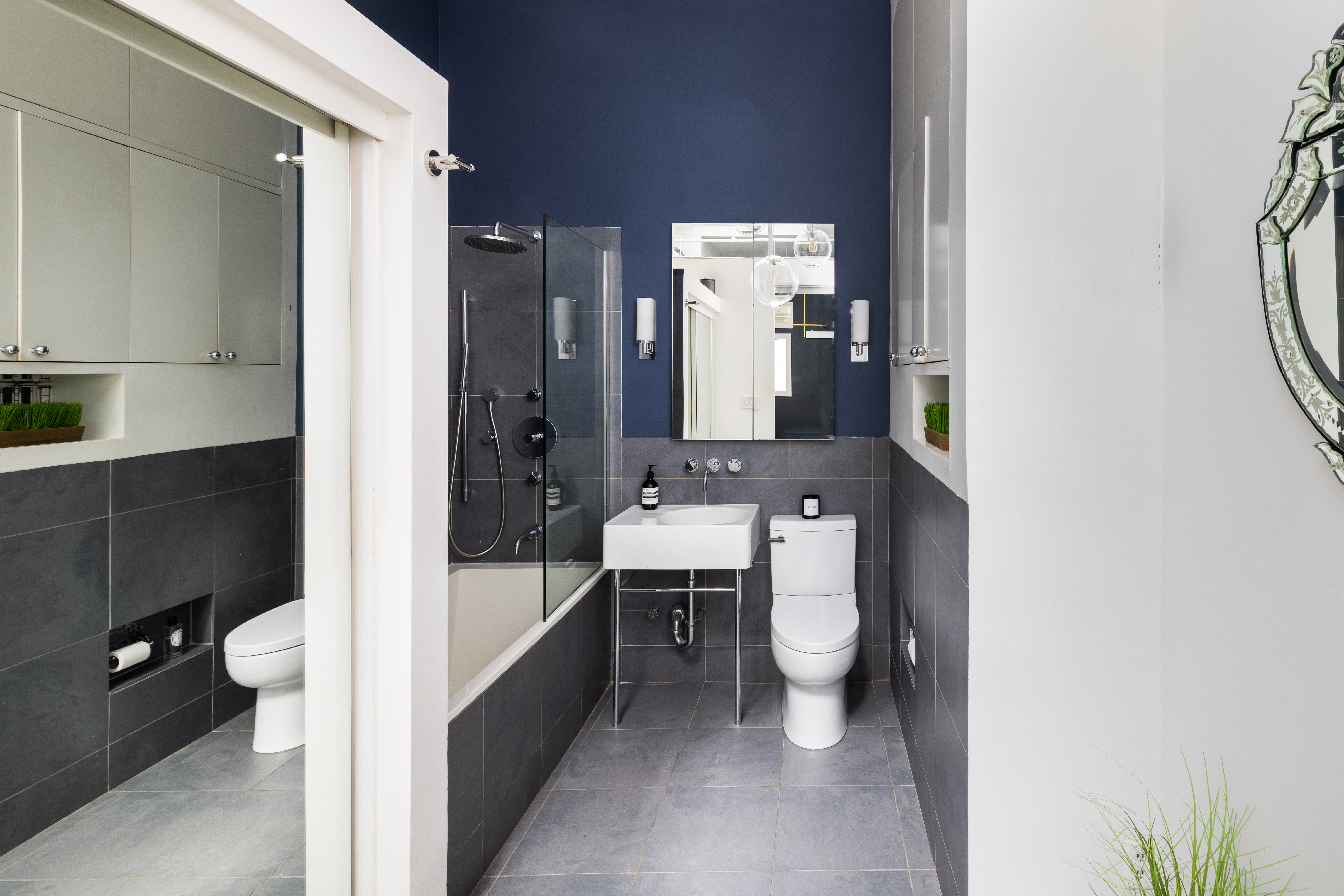 718 Broadway, Unit PHC Manhattan, NY 10003 - Photo 8 of 21 a bathroom with a bathtub shower sink and toilet