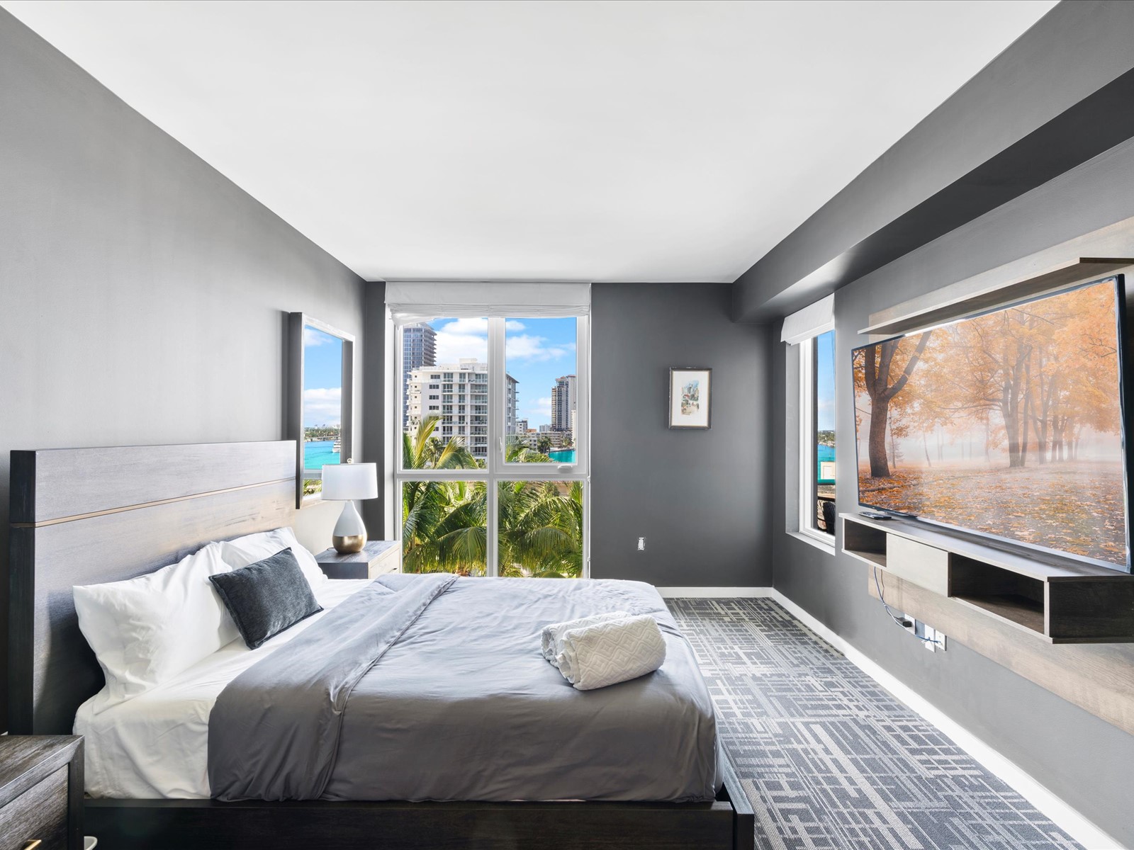 401 North Birch Road, Unit 603 Fort Lauderdale, FL 33304 - Photo 9 of 16 a bedroom with a bed and a large window