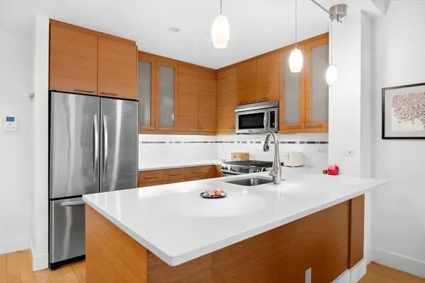 a kitchen with a sink a refrigerator and a sink