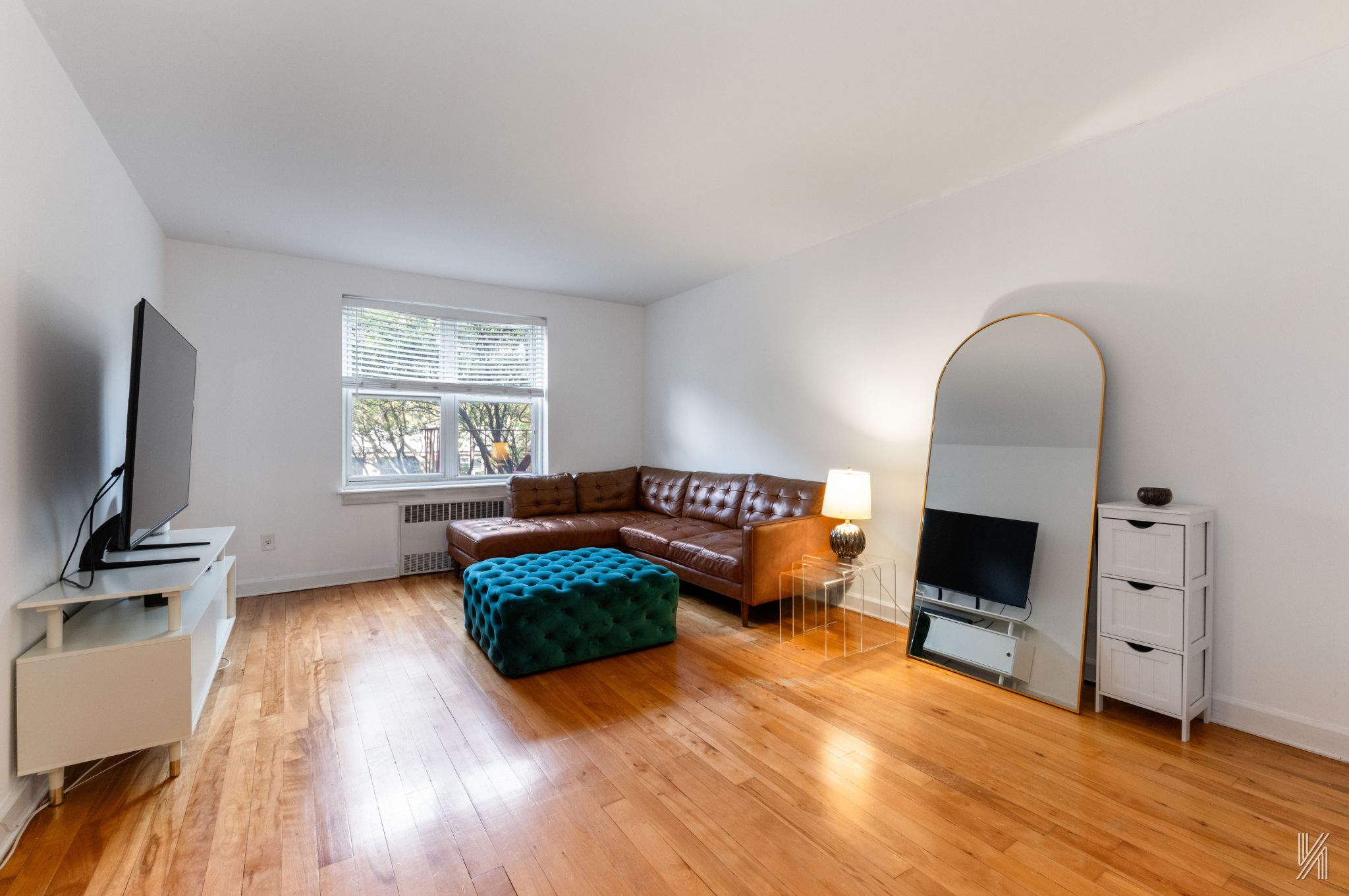 a living room with furniture flat screen tv and a fireplace