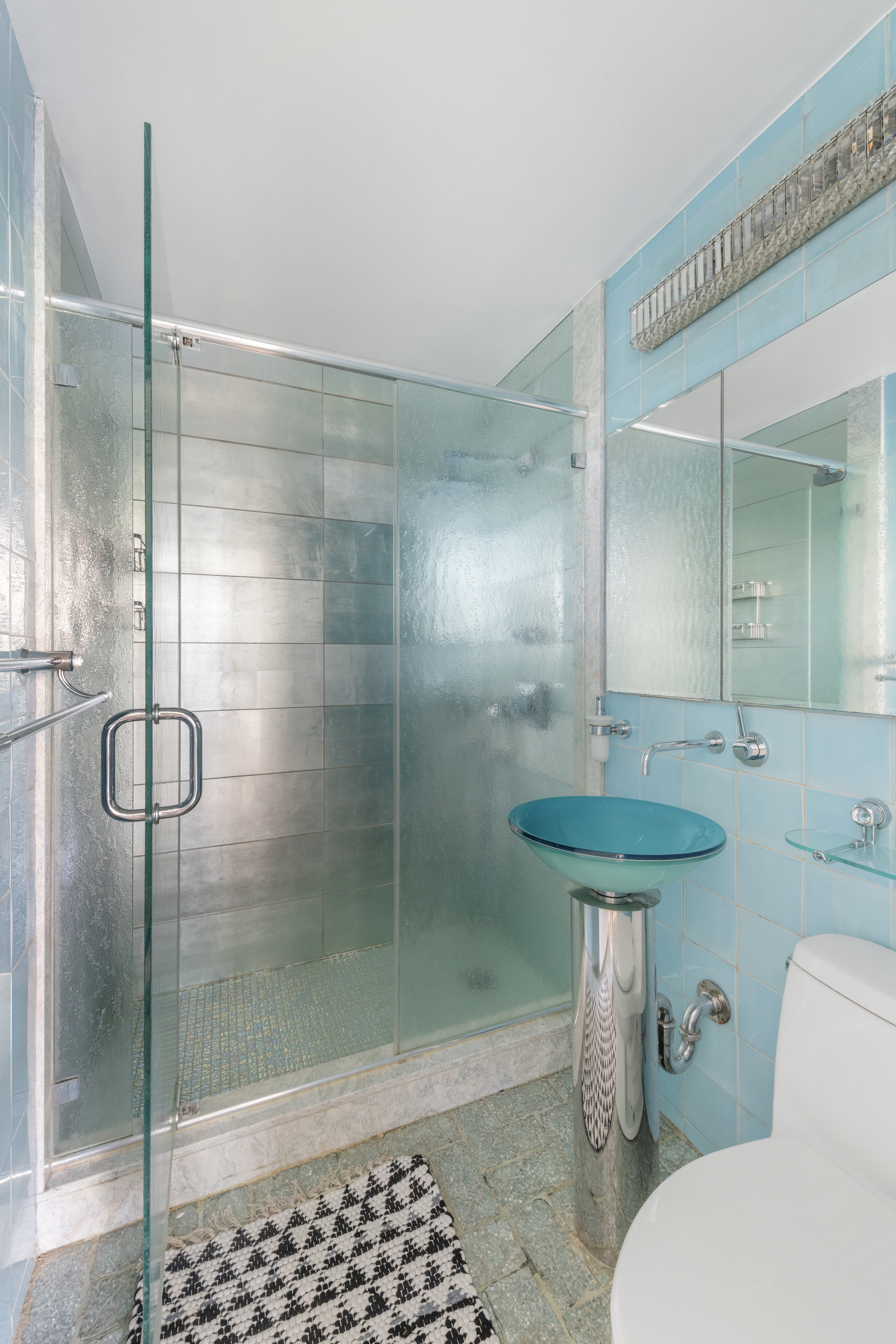350 East 62nd Street, Unit 2B Manhattan, NY 10065 - Photo 9 of 10 a bathroom with a shower and a toilet