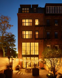 a front view of a building with outdoor space