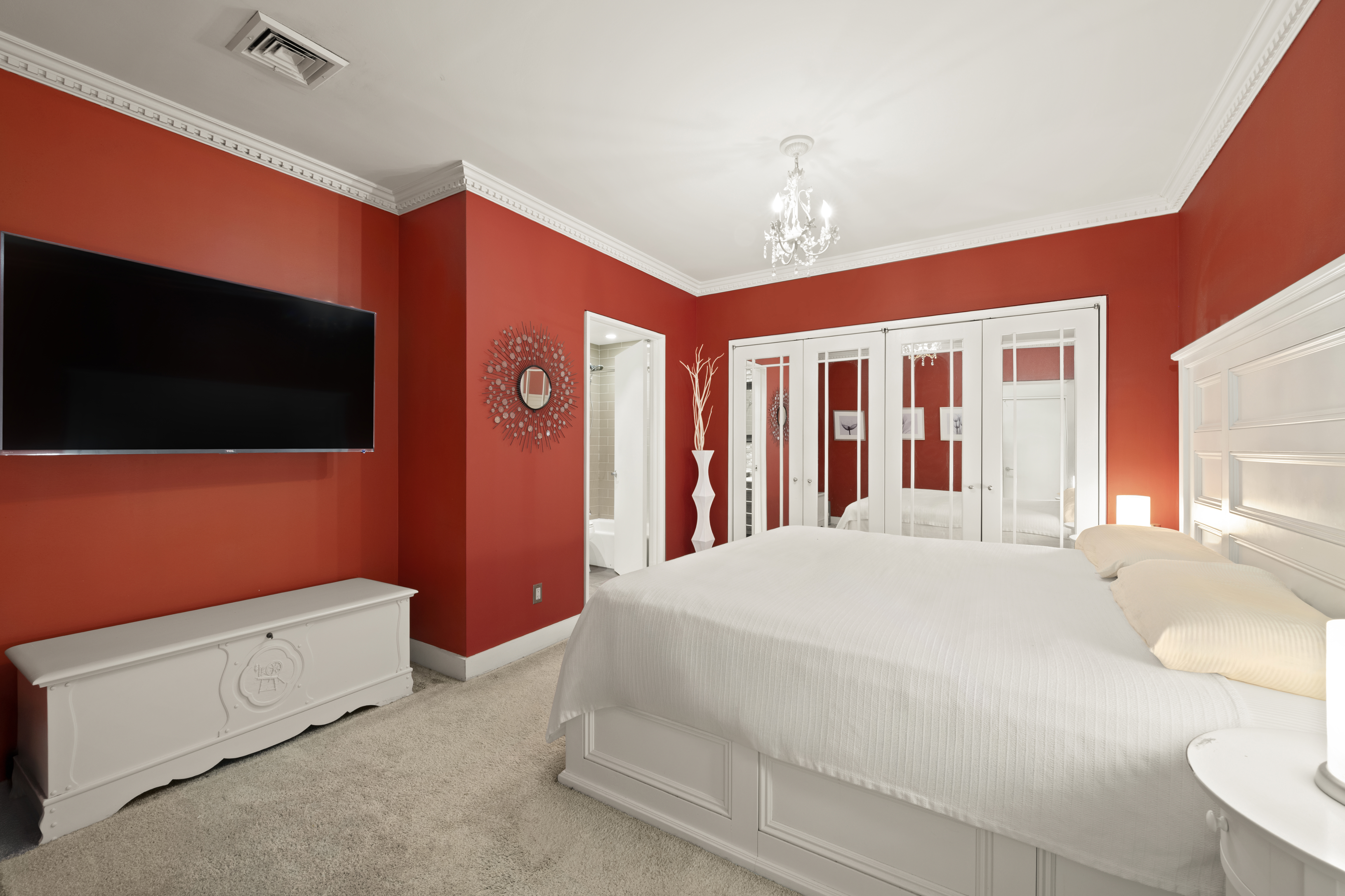 176 Broadway, Unit 9F Manhattan, NY 10038 - Photo 5 of 9 a bedroom with a bed and a flat screen tv