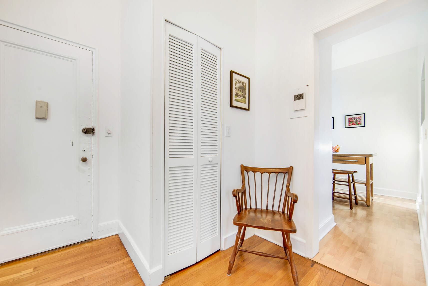 215 West 105th Street, Unit 5DPH Manhattan, NY 10025 - Photo 11 of 16 a chair and a table in a room